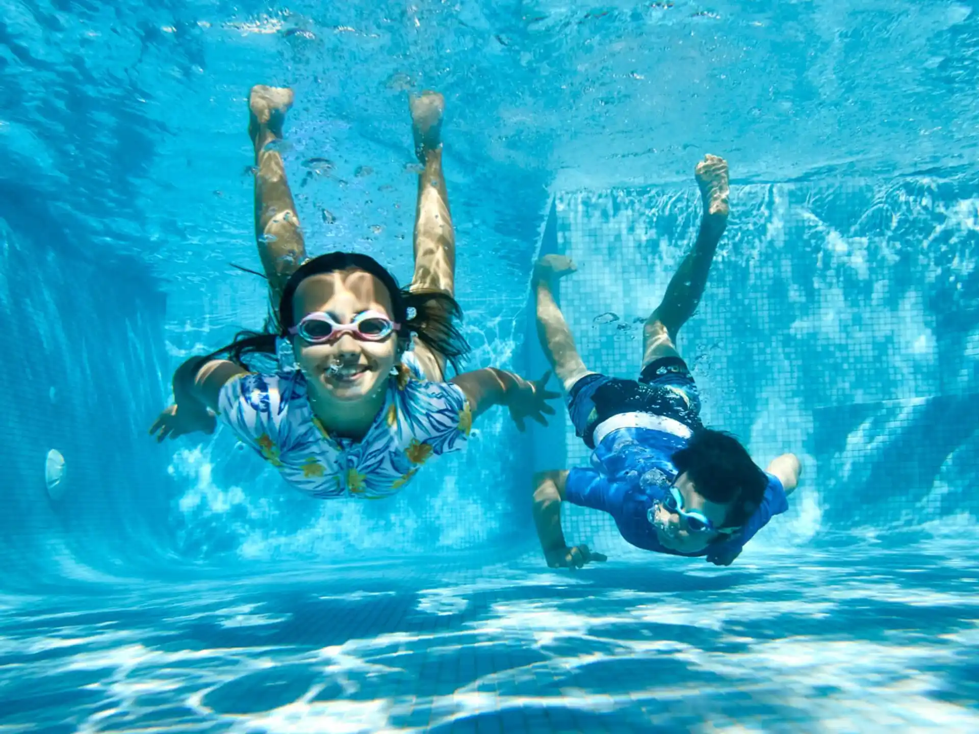 a man and woman in a pool
