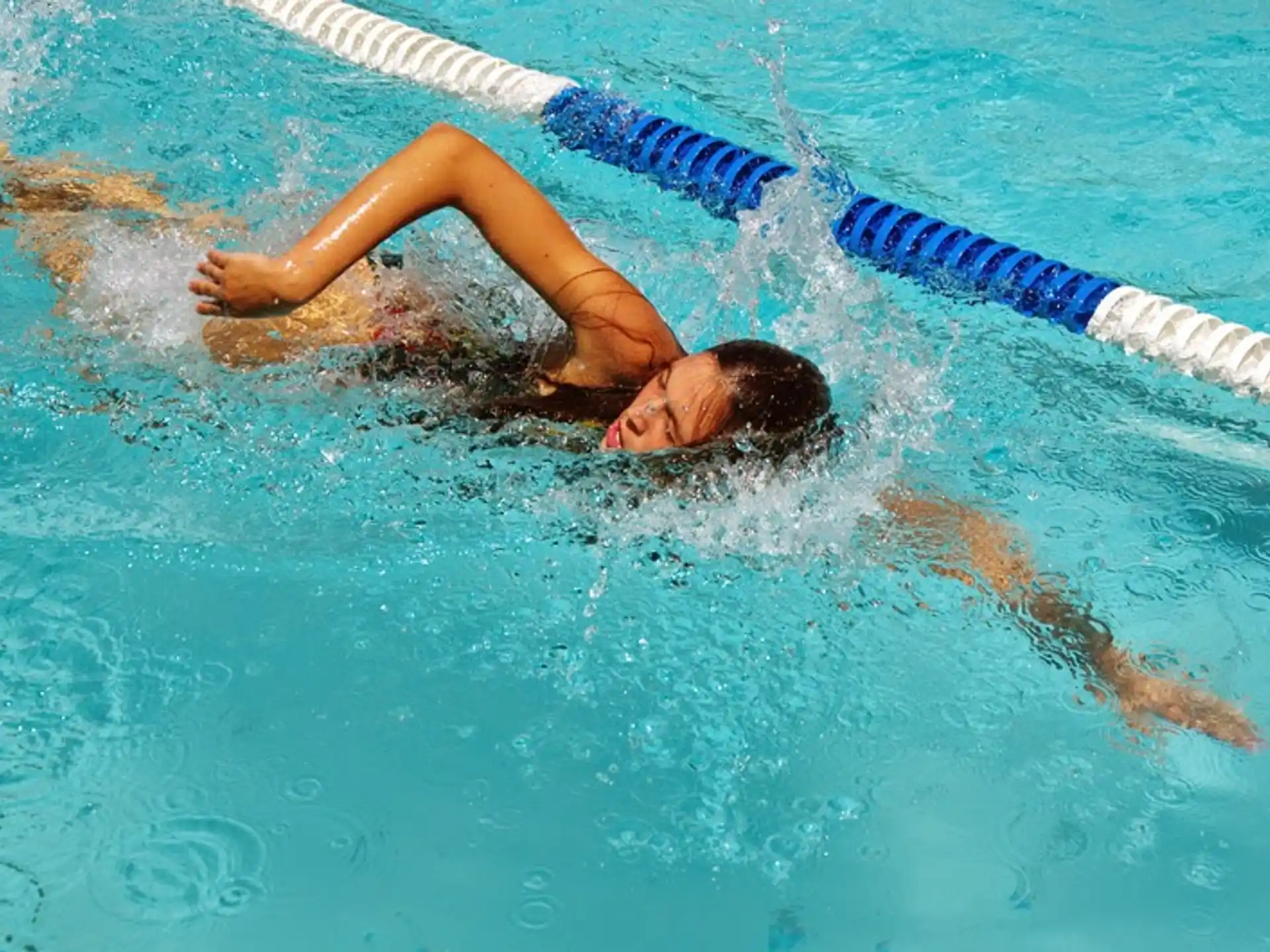 a person swimming in a pool