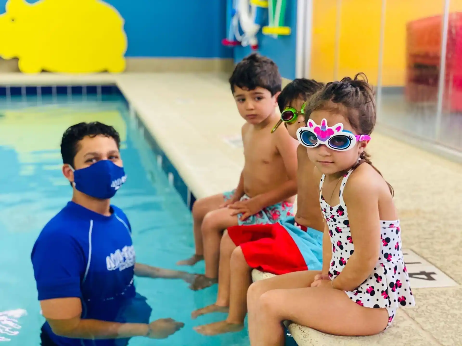 a group of kids in a pool