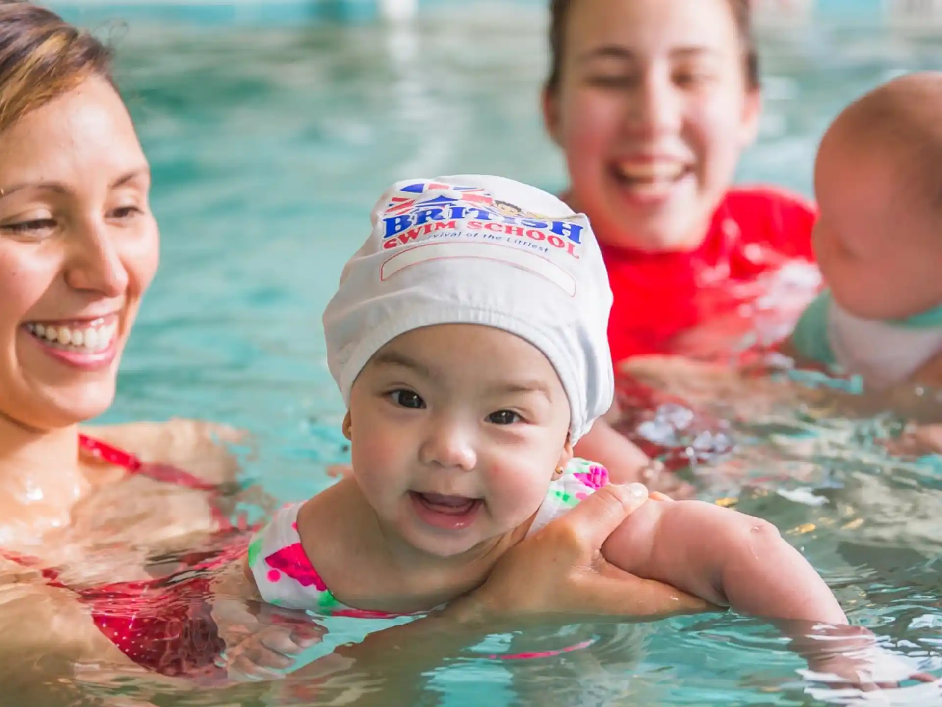 a group of children in a pool