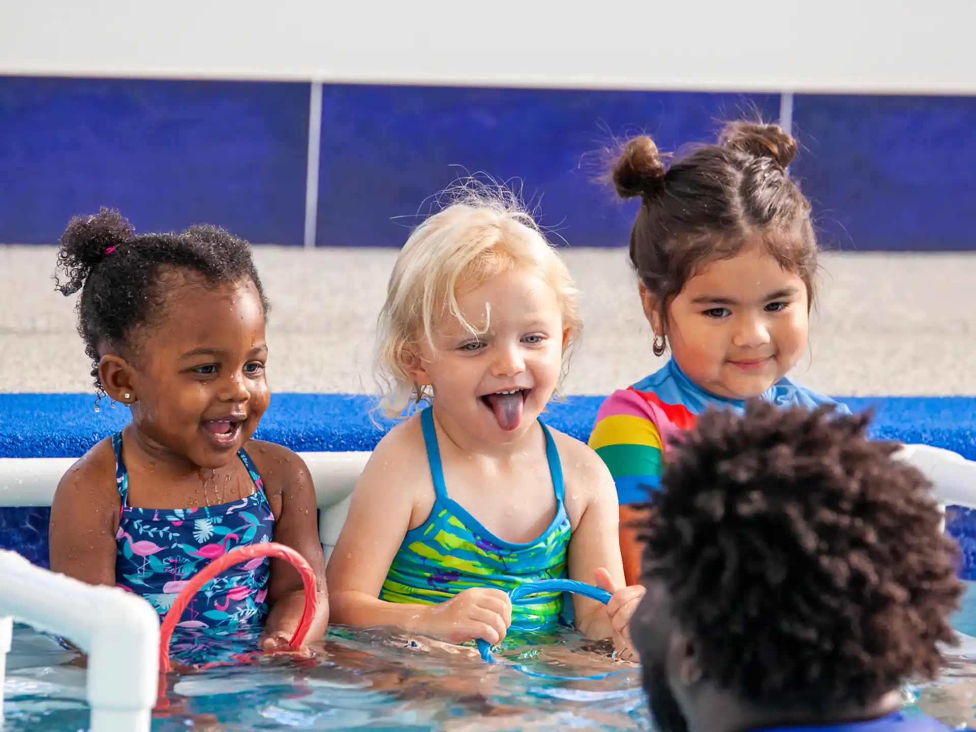 a group of children in a pool