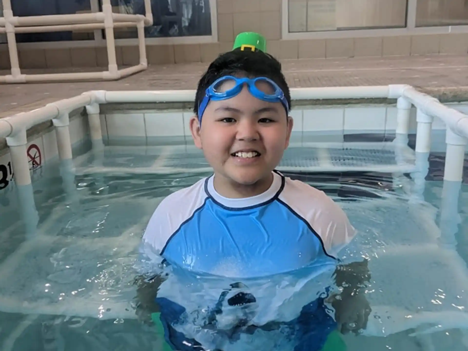a boy in a pool