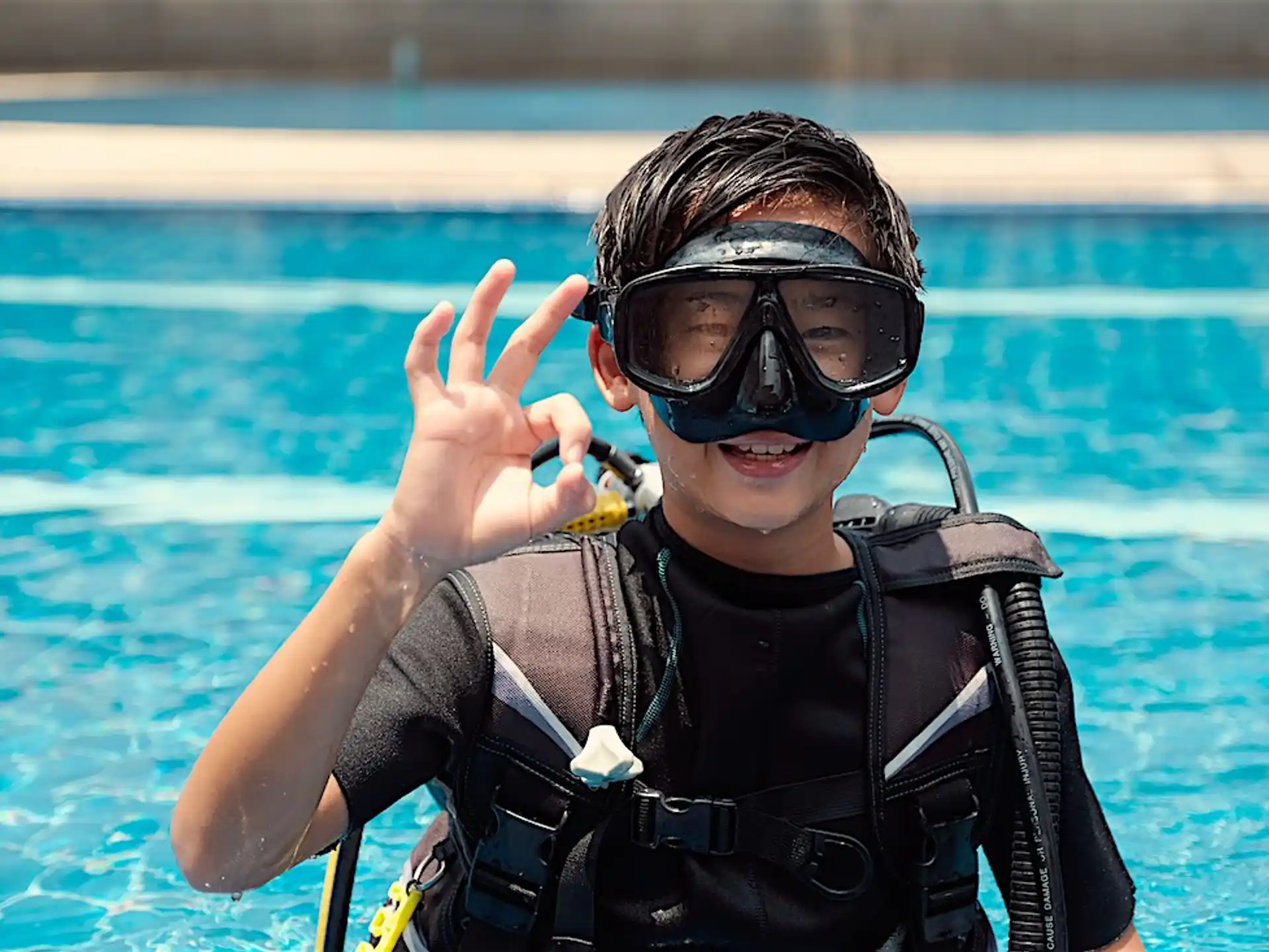 a person wearing goggles and a scuba diving suit