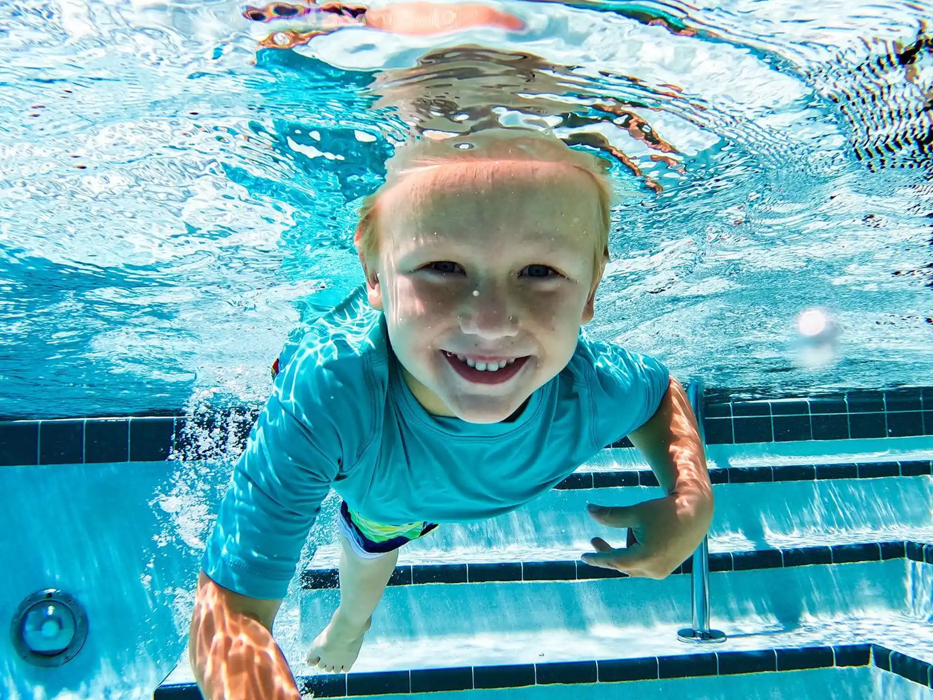 a boy in a pool