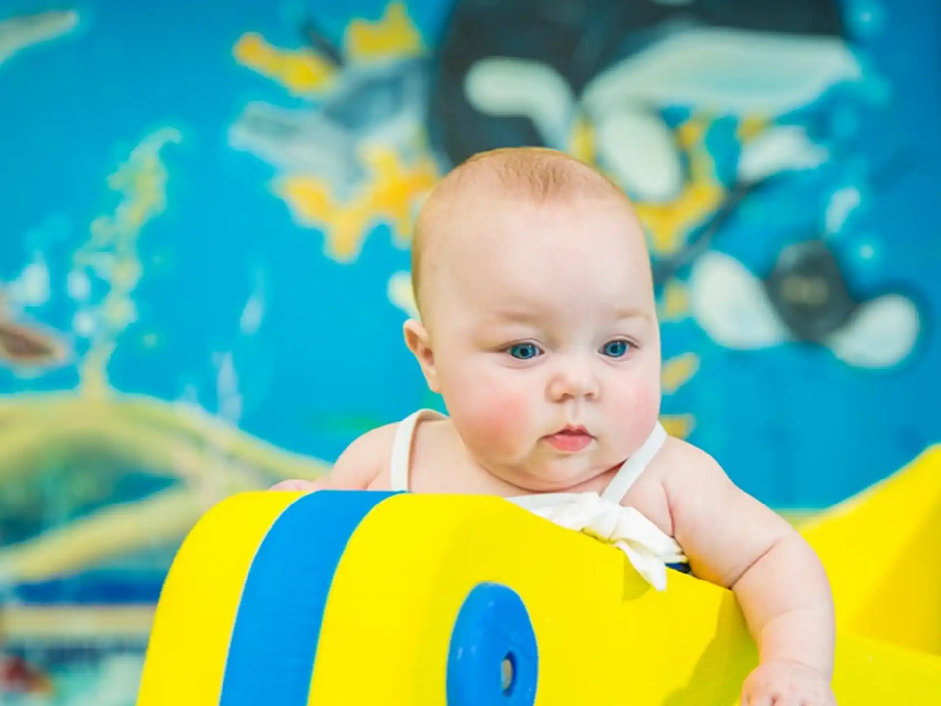 a baby in a toy car