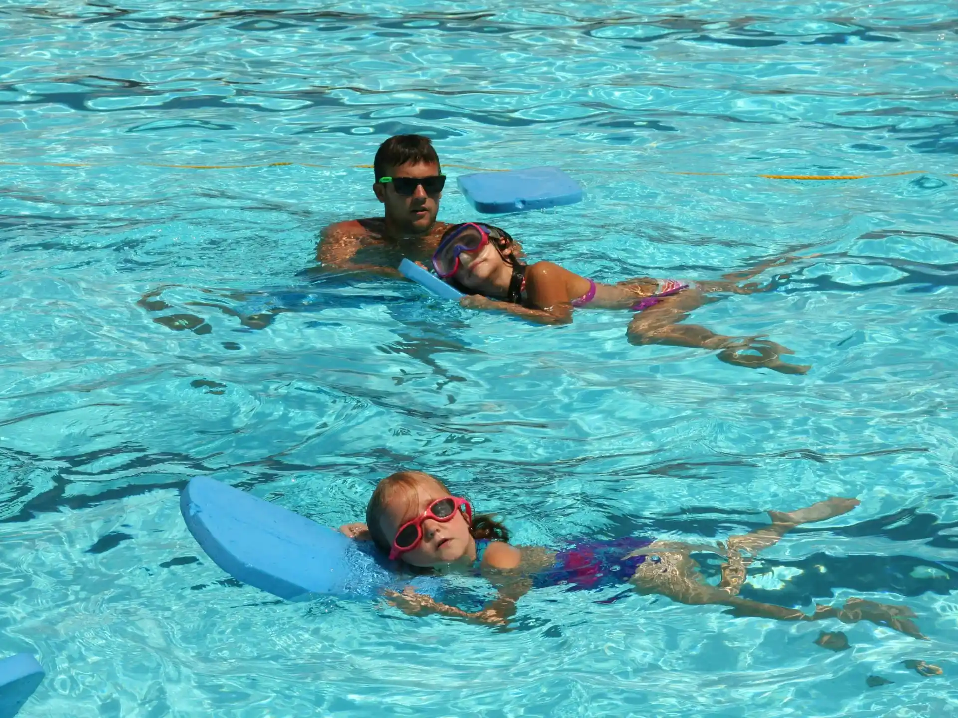 a man and a woman swimming in the water