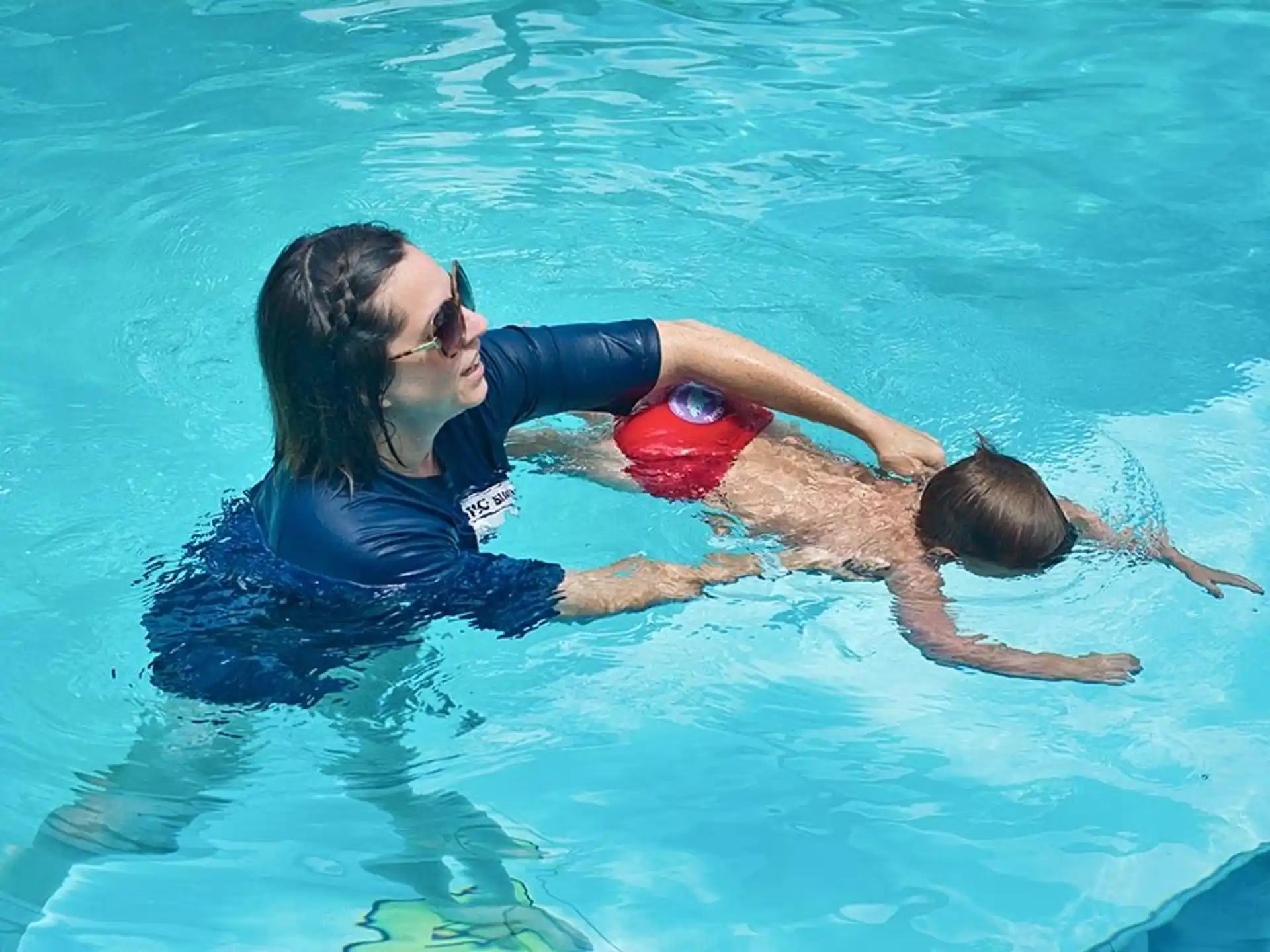 a woman and a man in a pool
