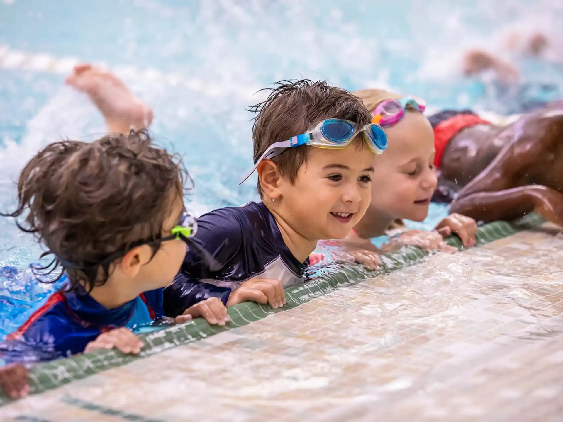 a group of children in a pool