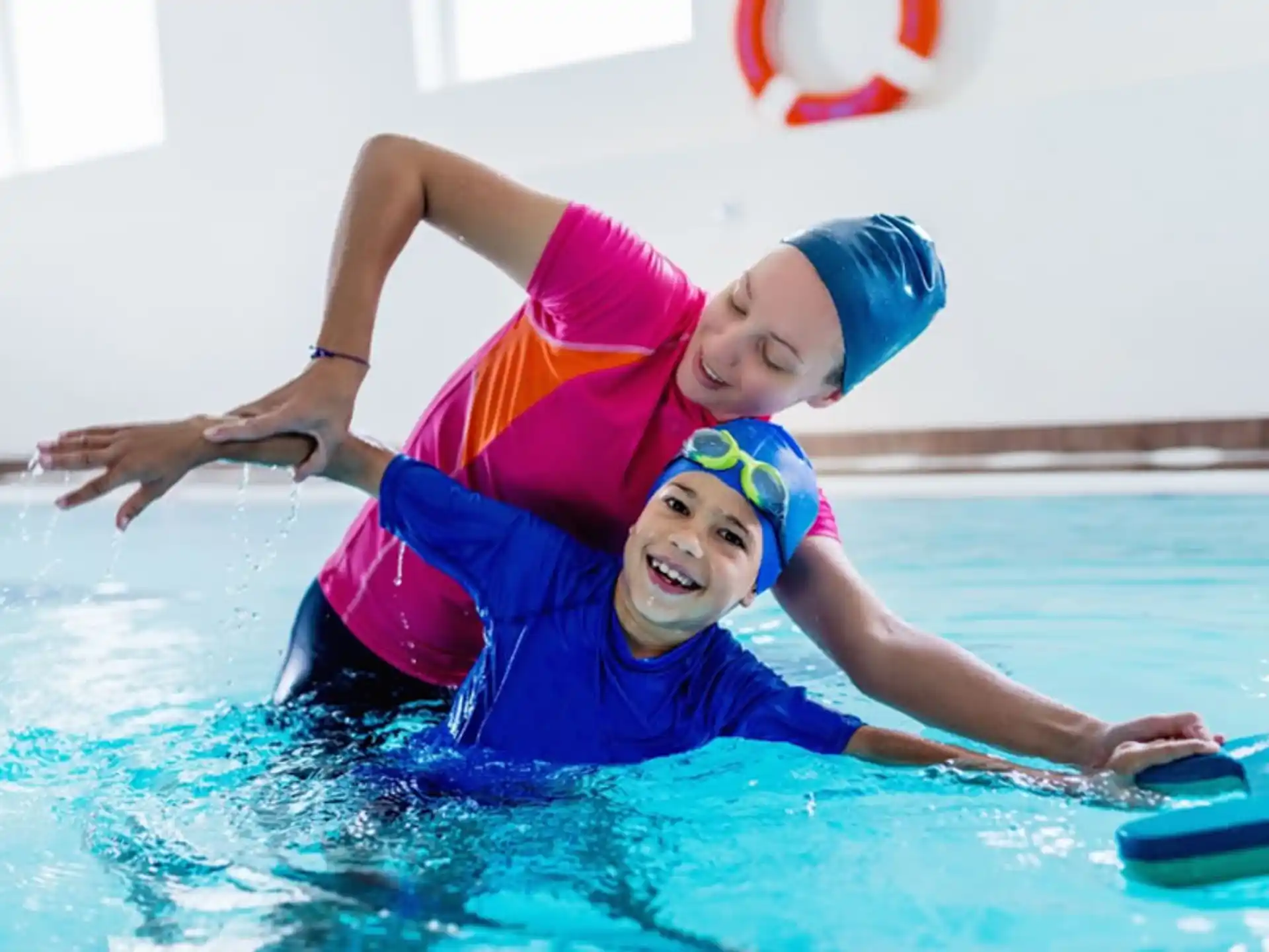 a couple of kids in a pool