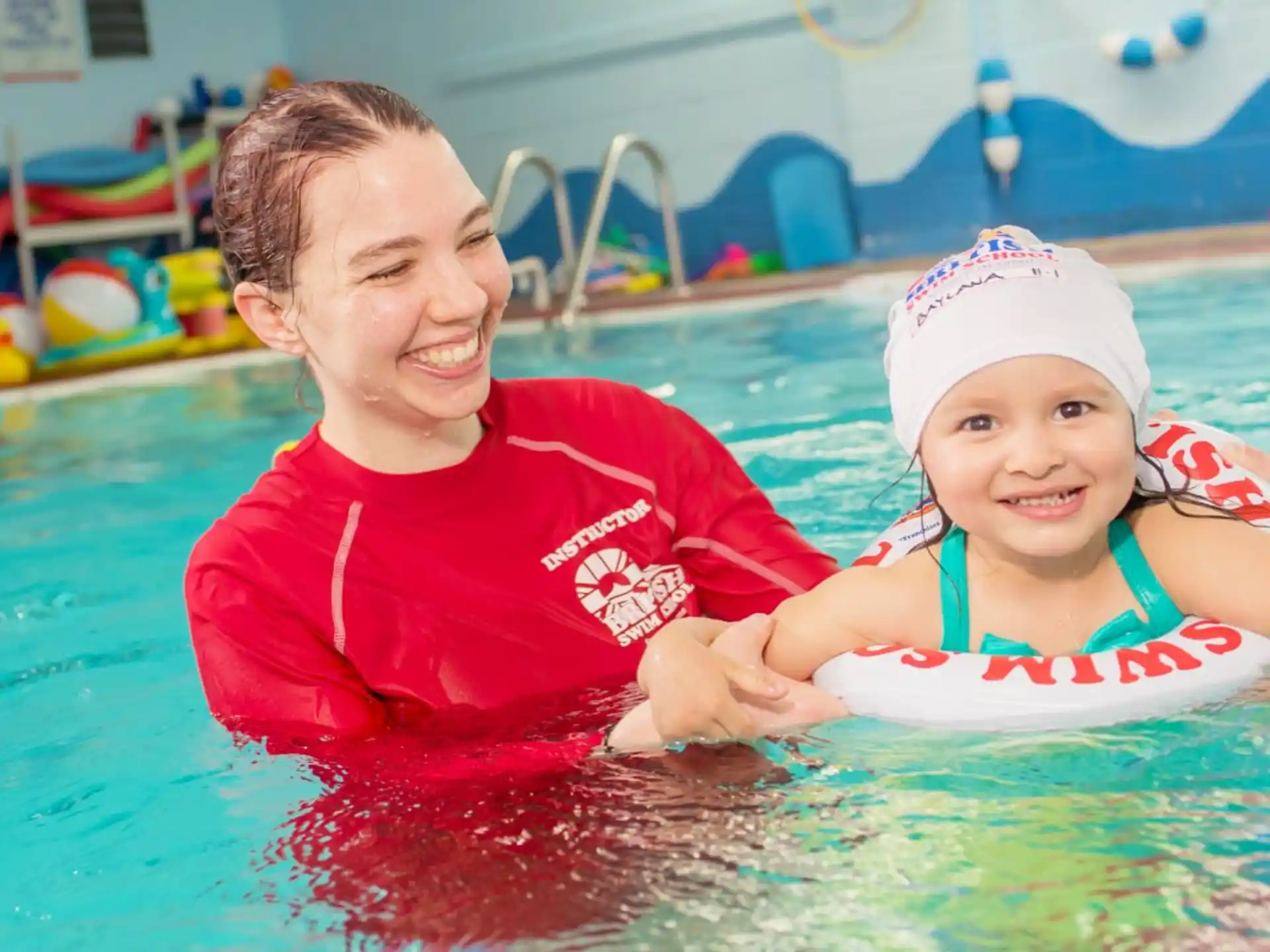 a person and a child in a pool
