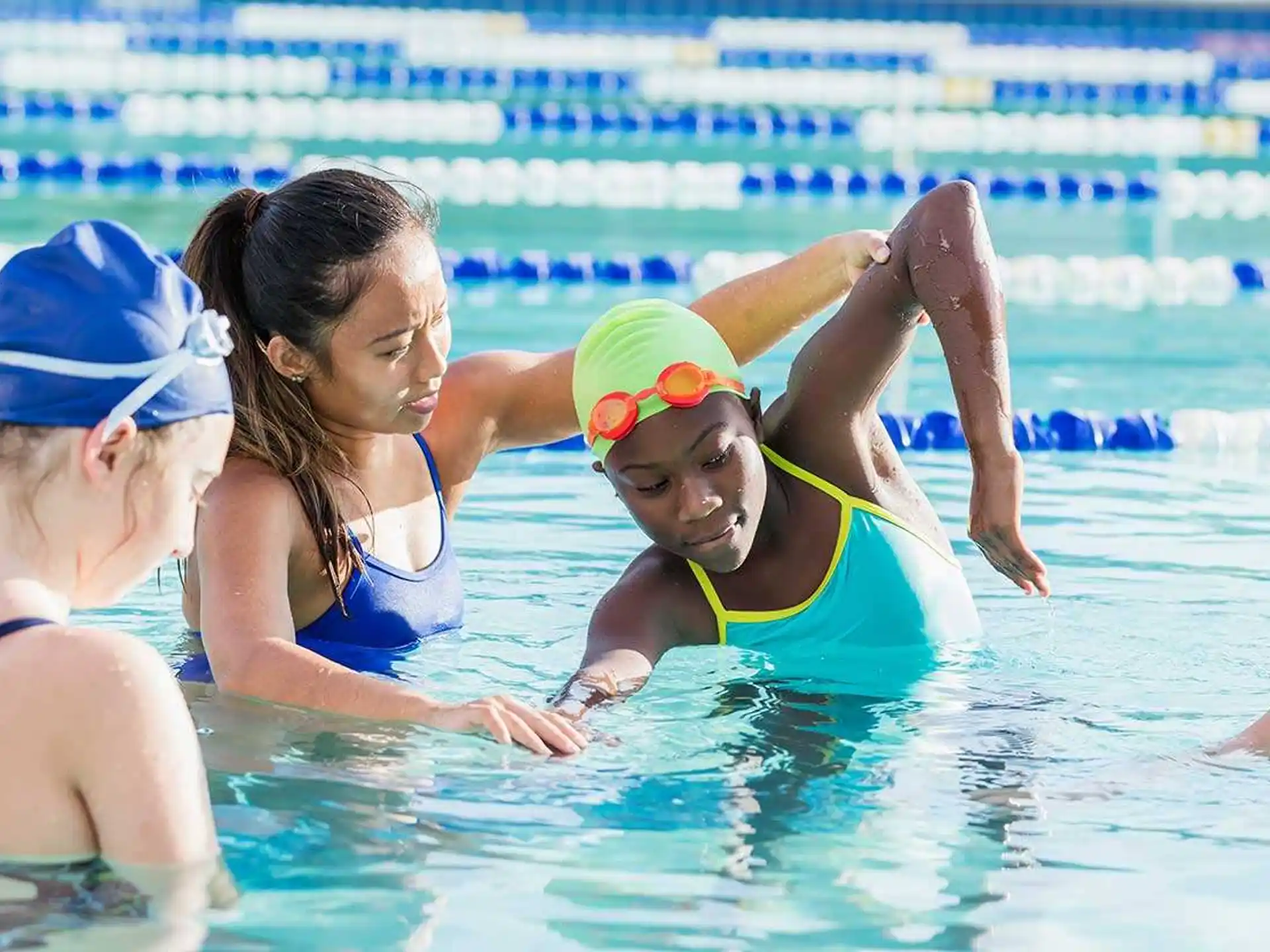a group of women in a pool
