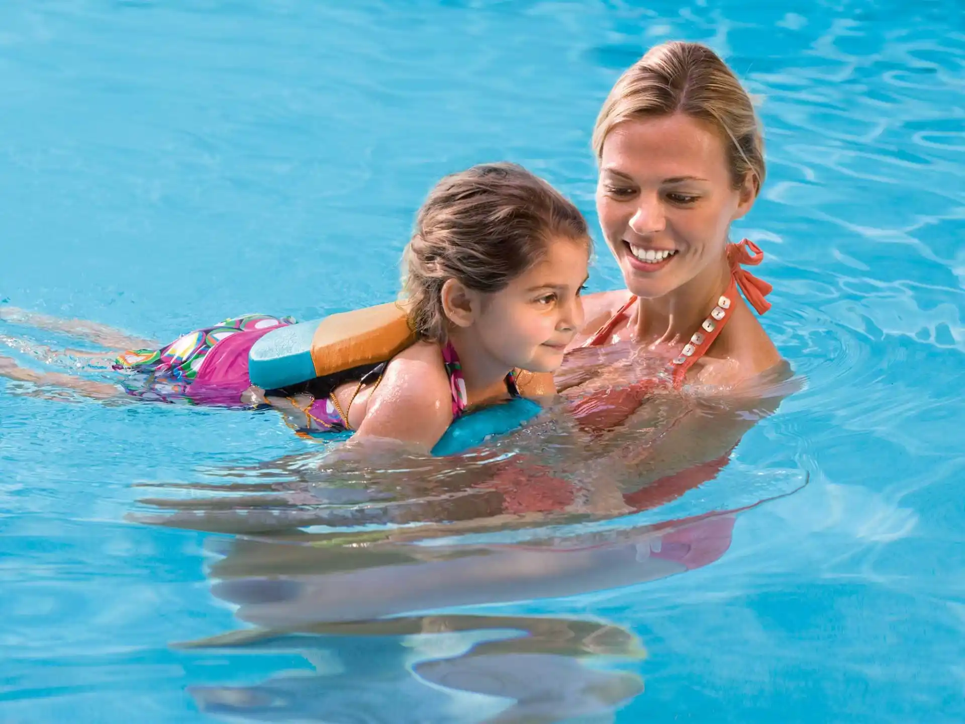 a person and a girl in the water