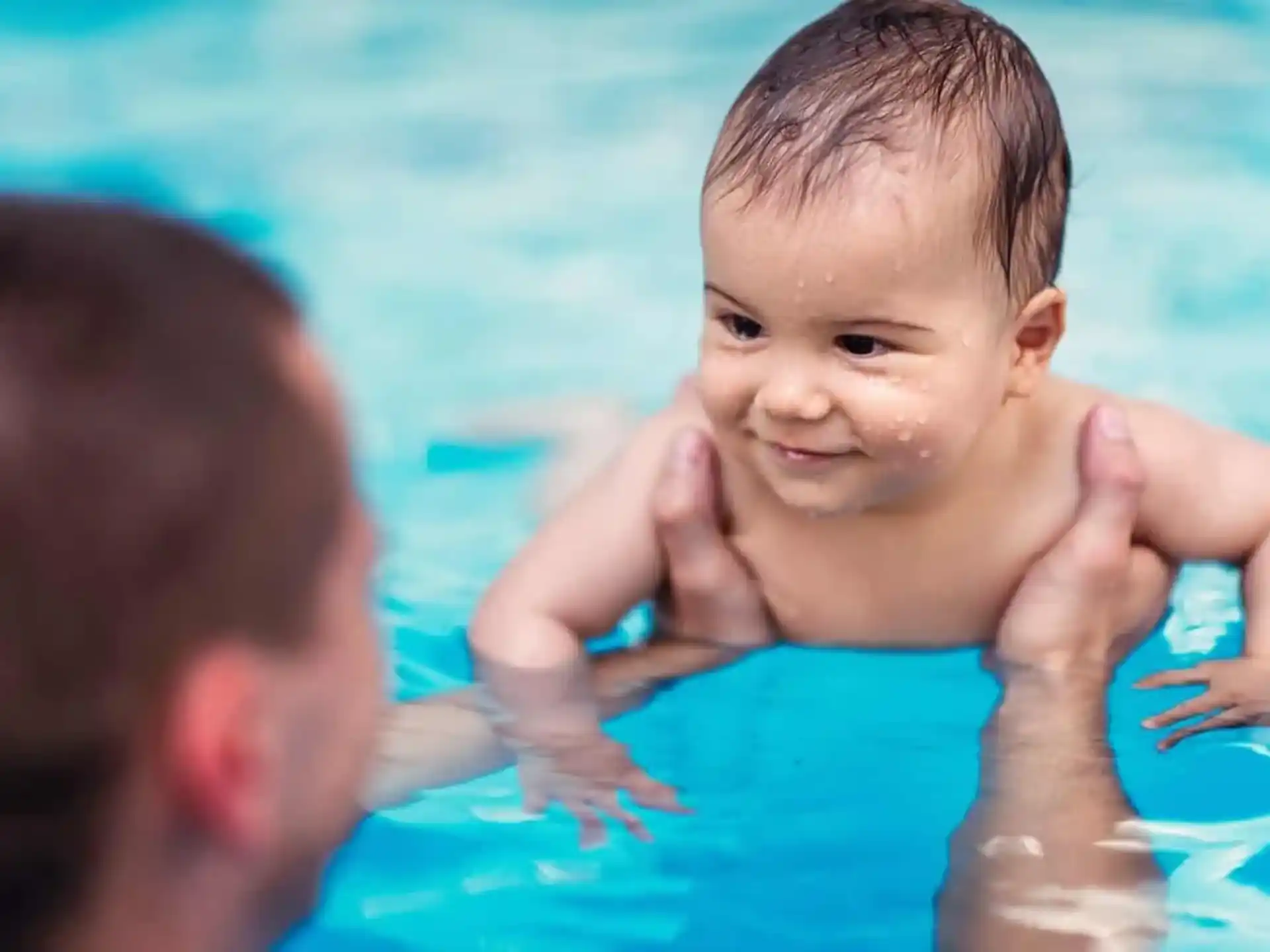 a baby in a pool