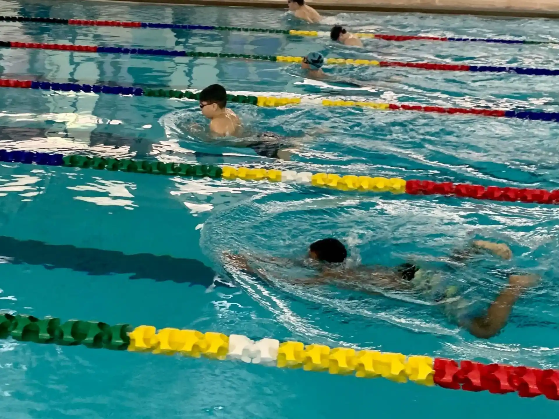 a group of people in a pool