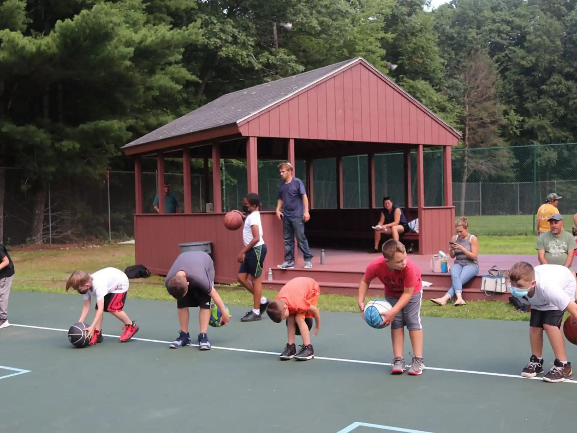 a group of people playing volleyball