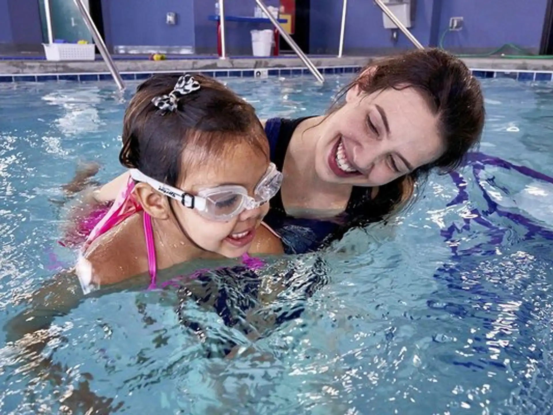 a man and woman in a pool