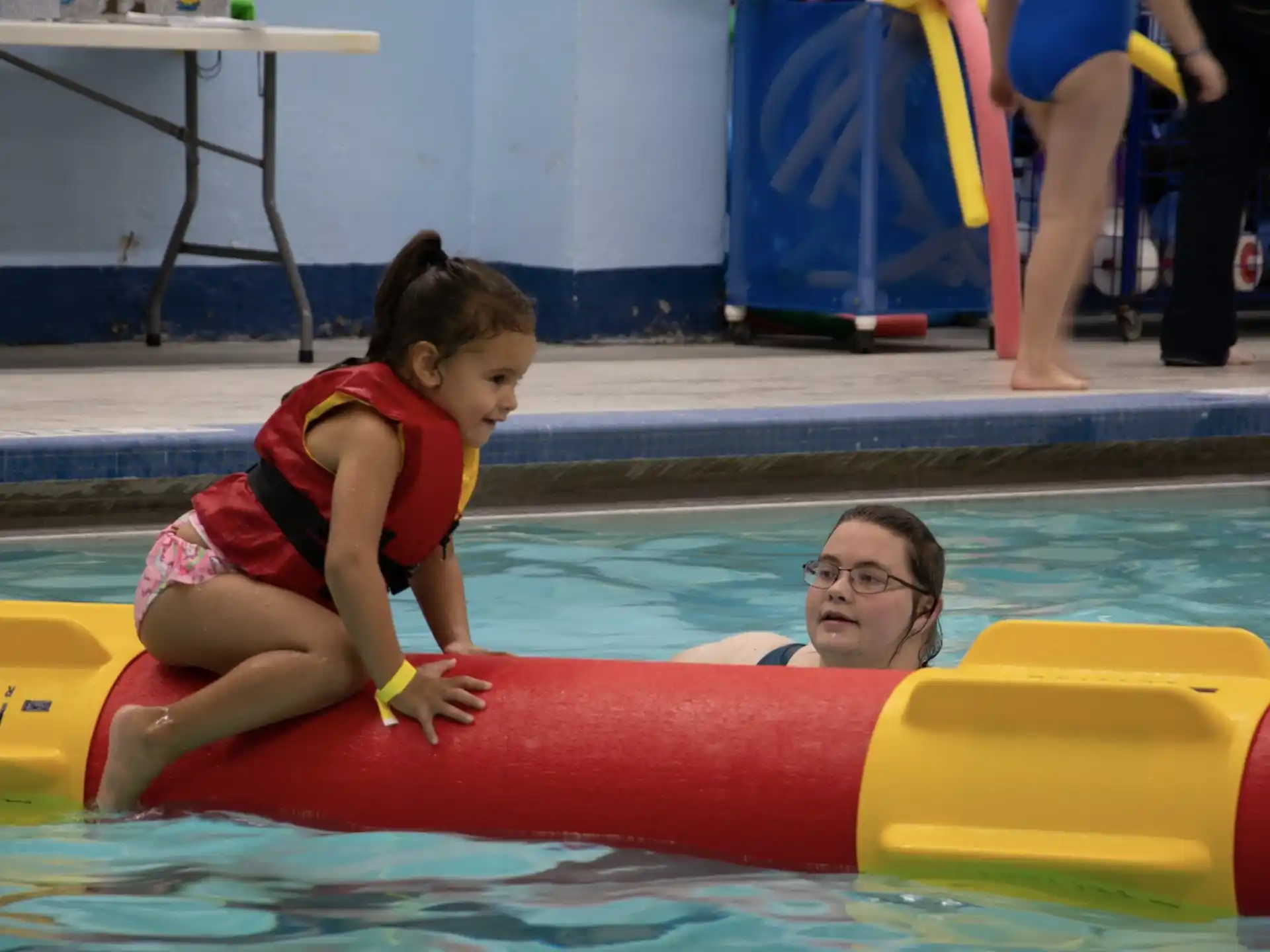 a person and a child in a pool