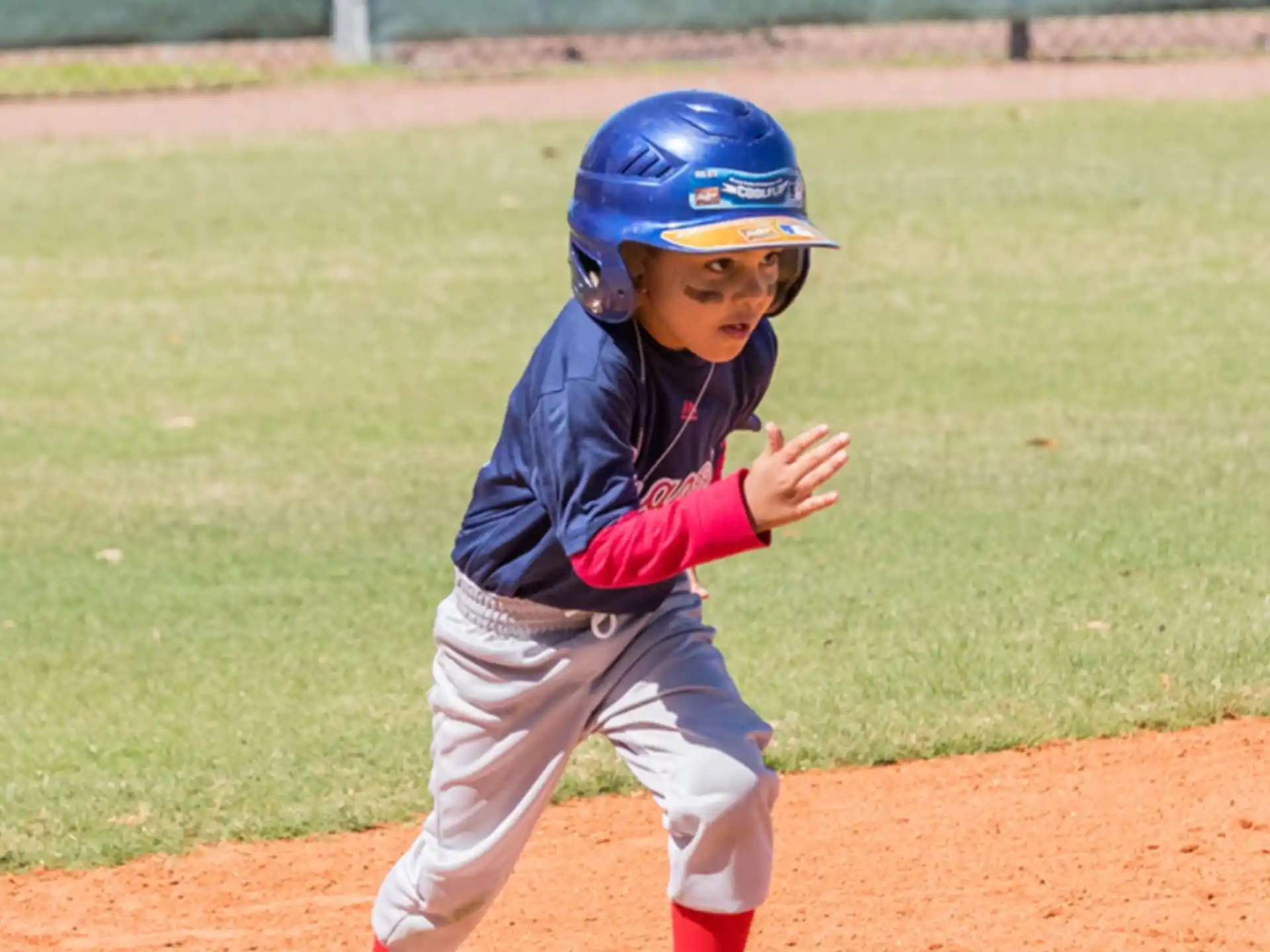 a young boy playing baseball