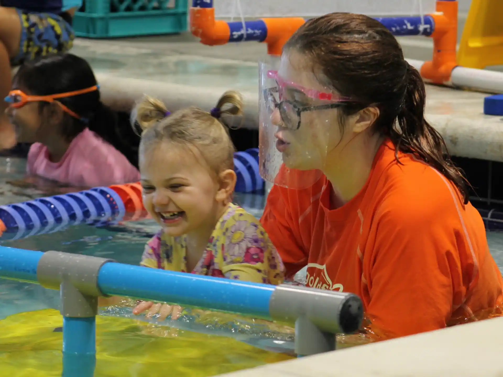 a group of children in a pool