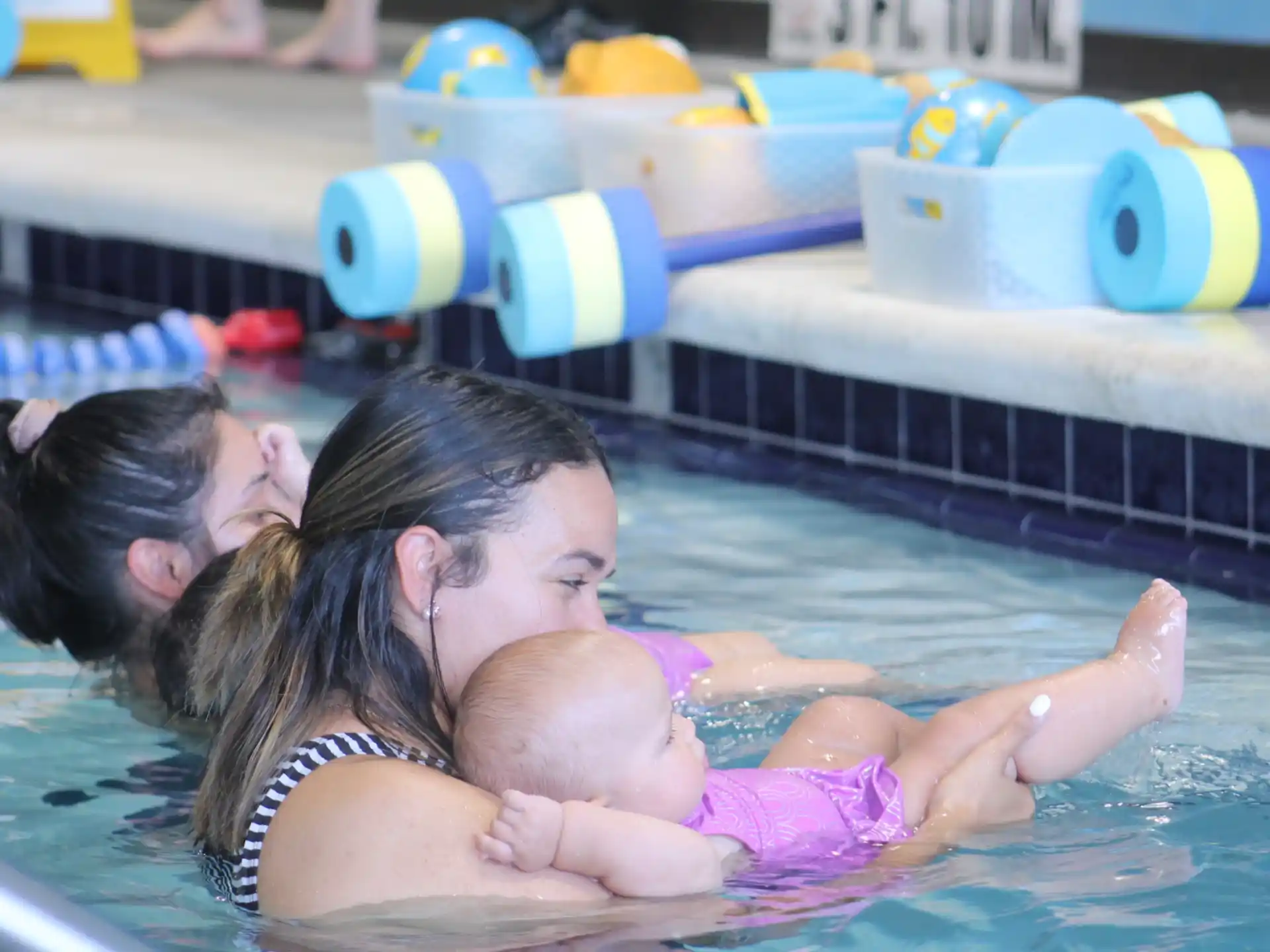 a person and a child in a pool