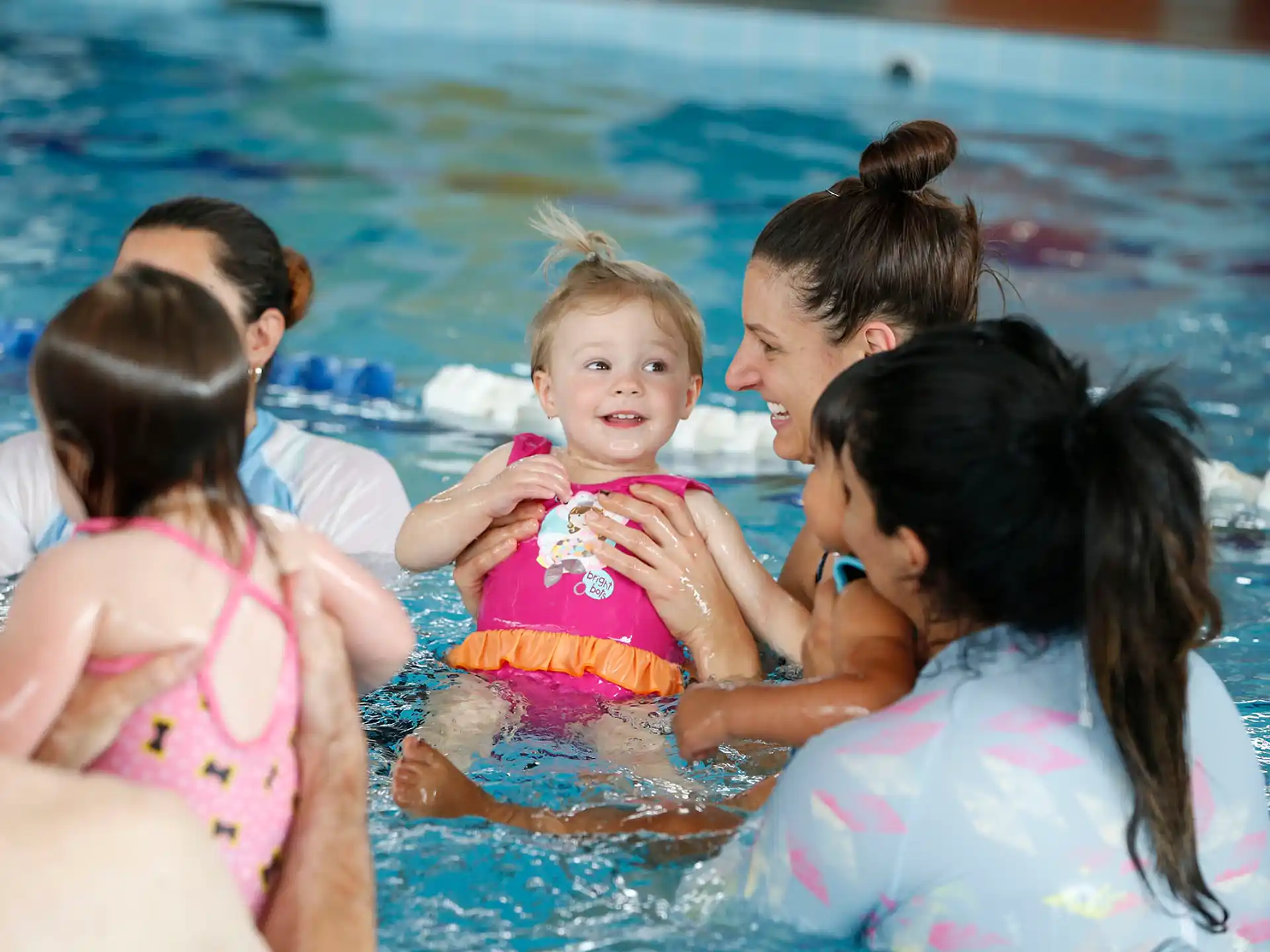 a group of people in a pool
