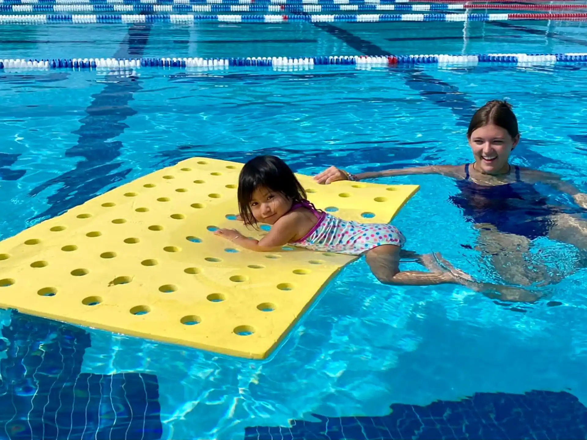a couple of people in a pool