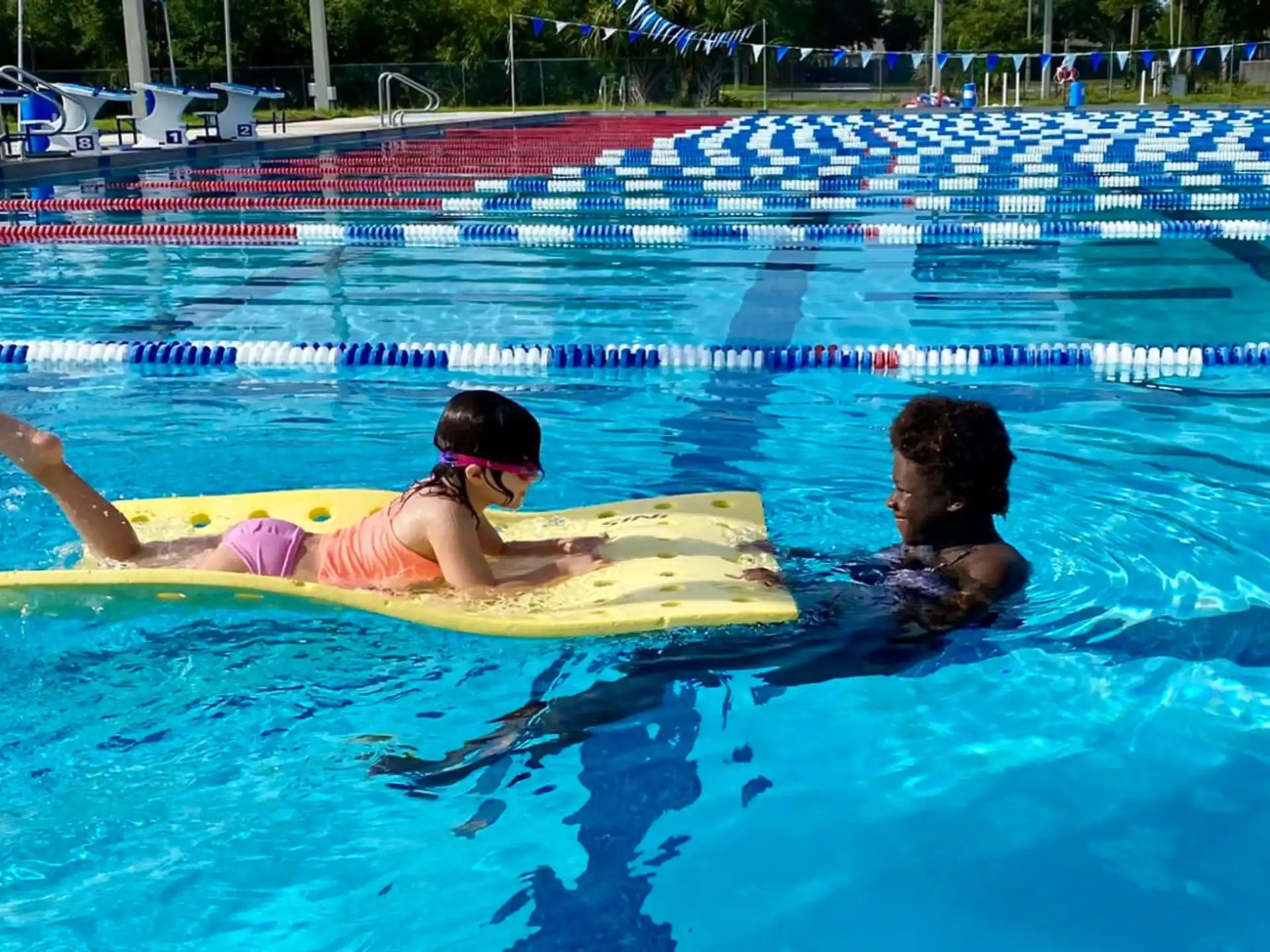 a man and woman in a pool