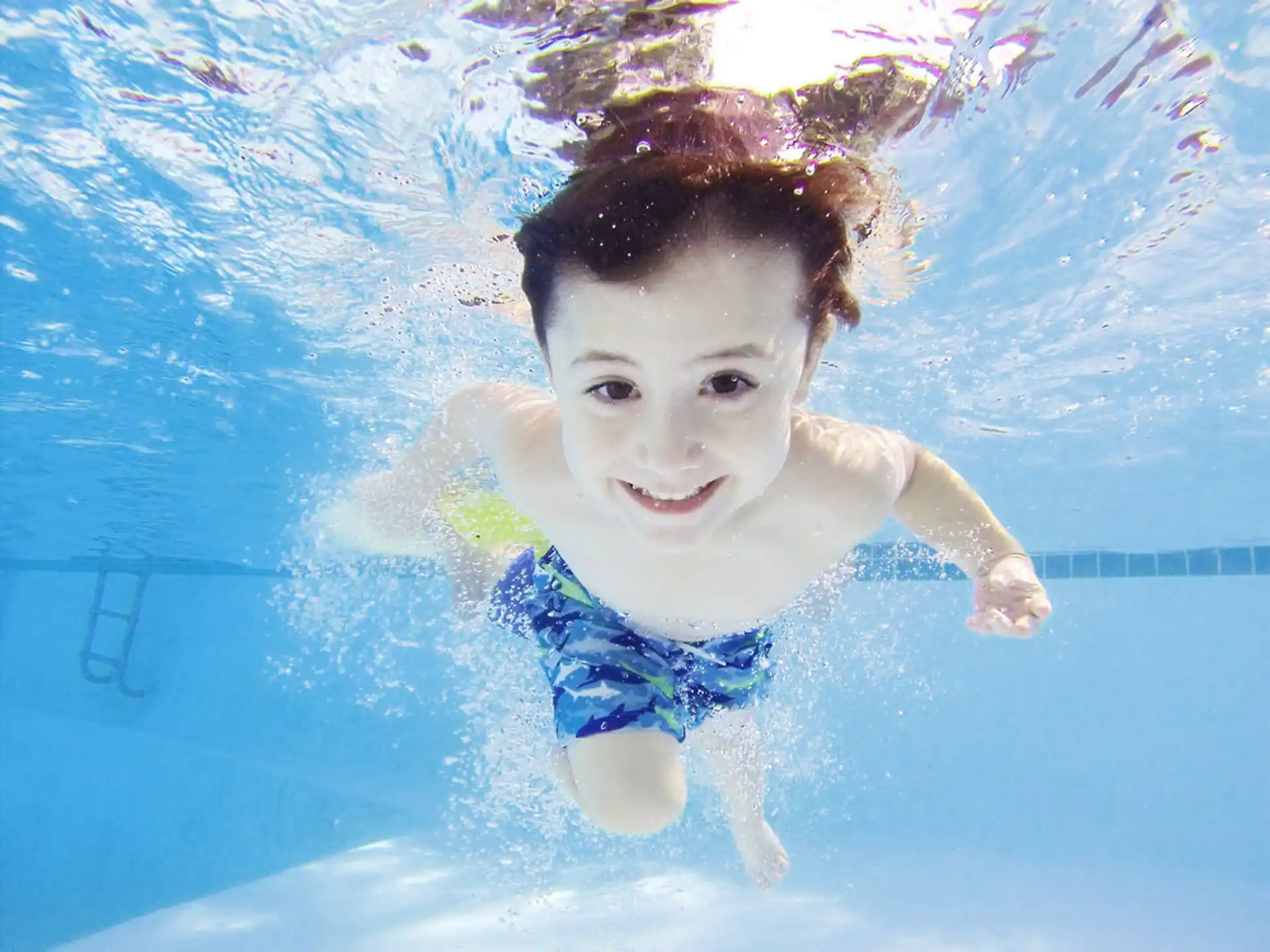 a boy in a pool