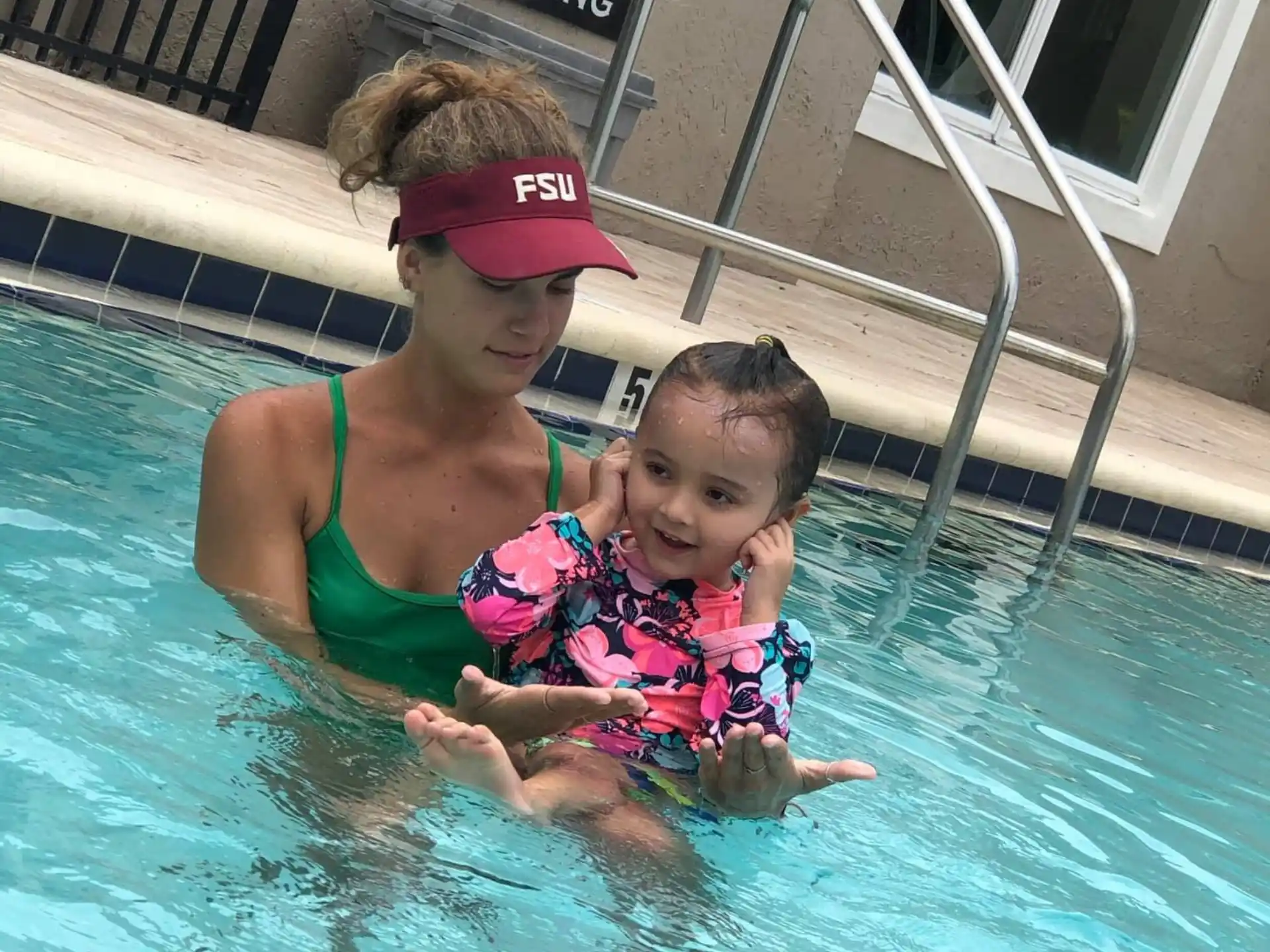 a person and a child in a pool