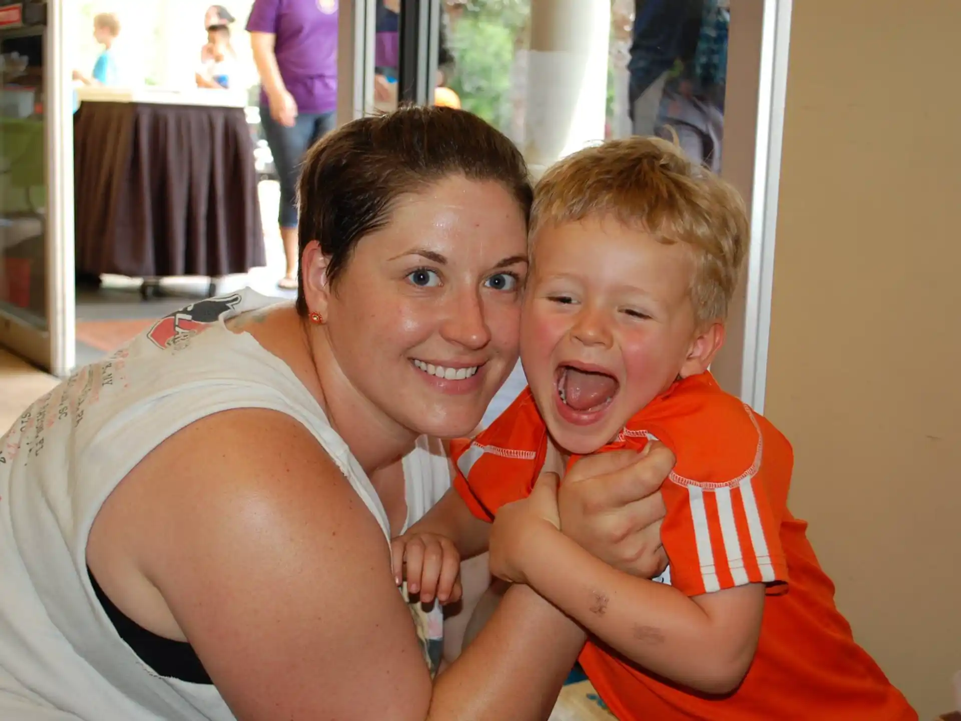 a person and a boy posing for a picture