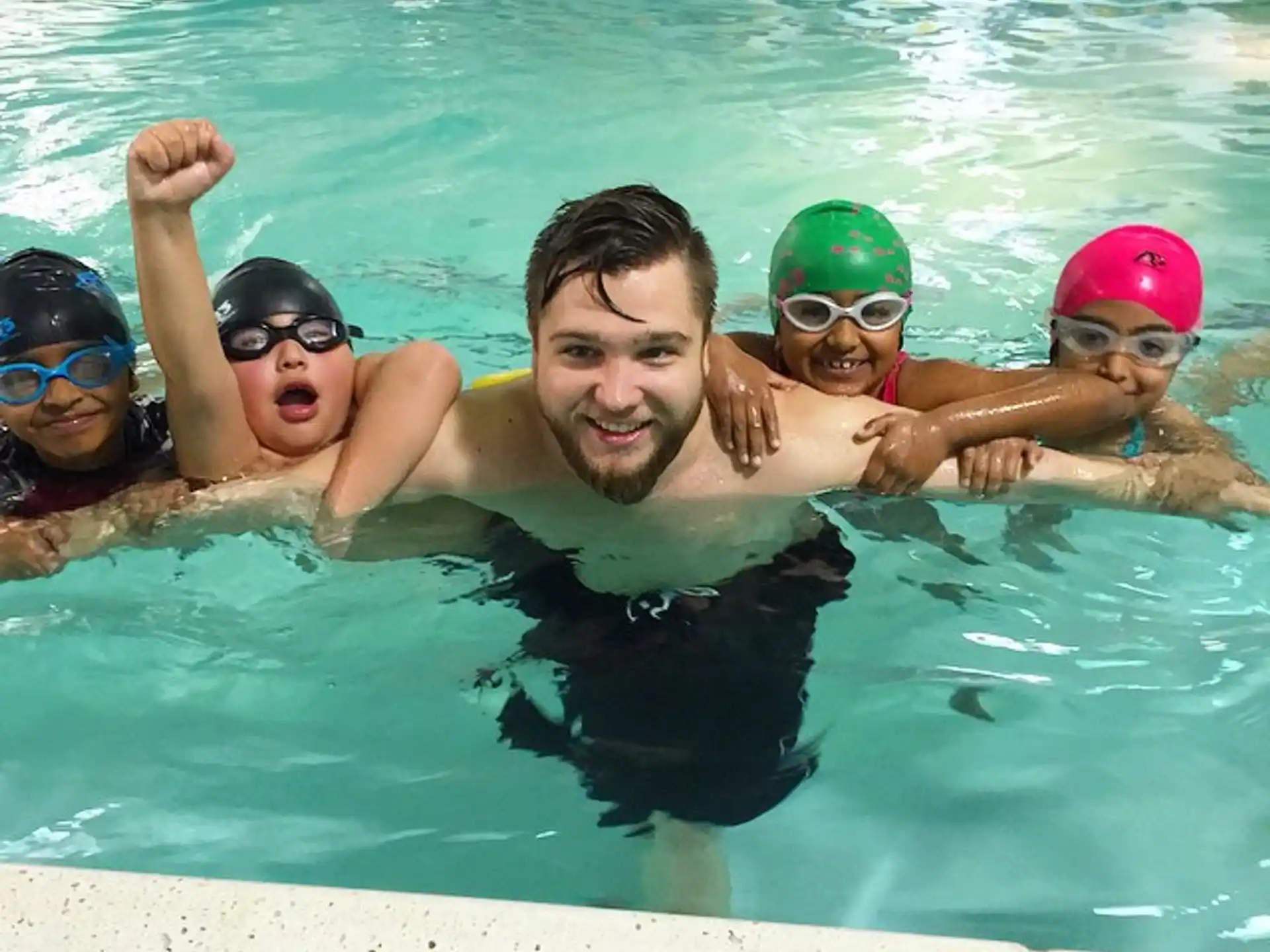 a group of people in a pool
