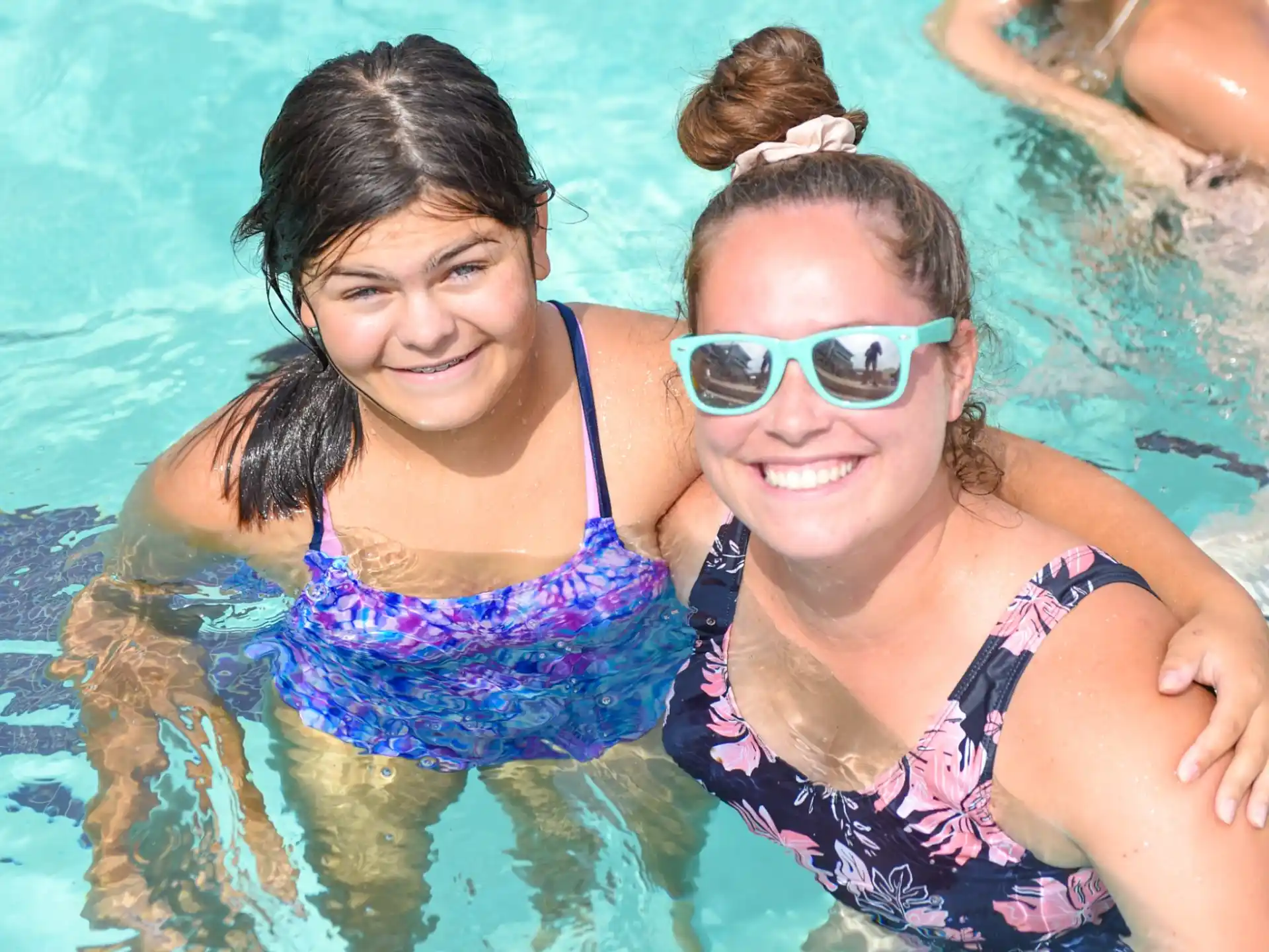 a couple of women in a pool