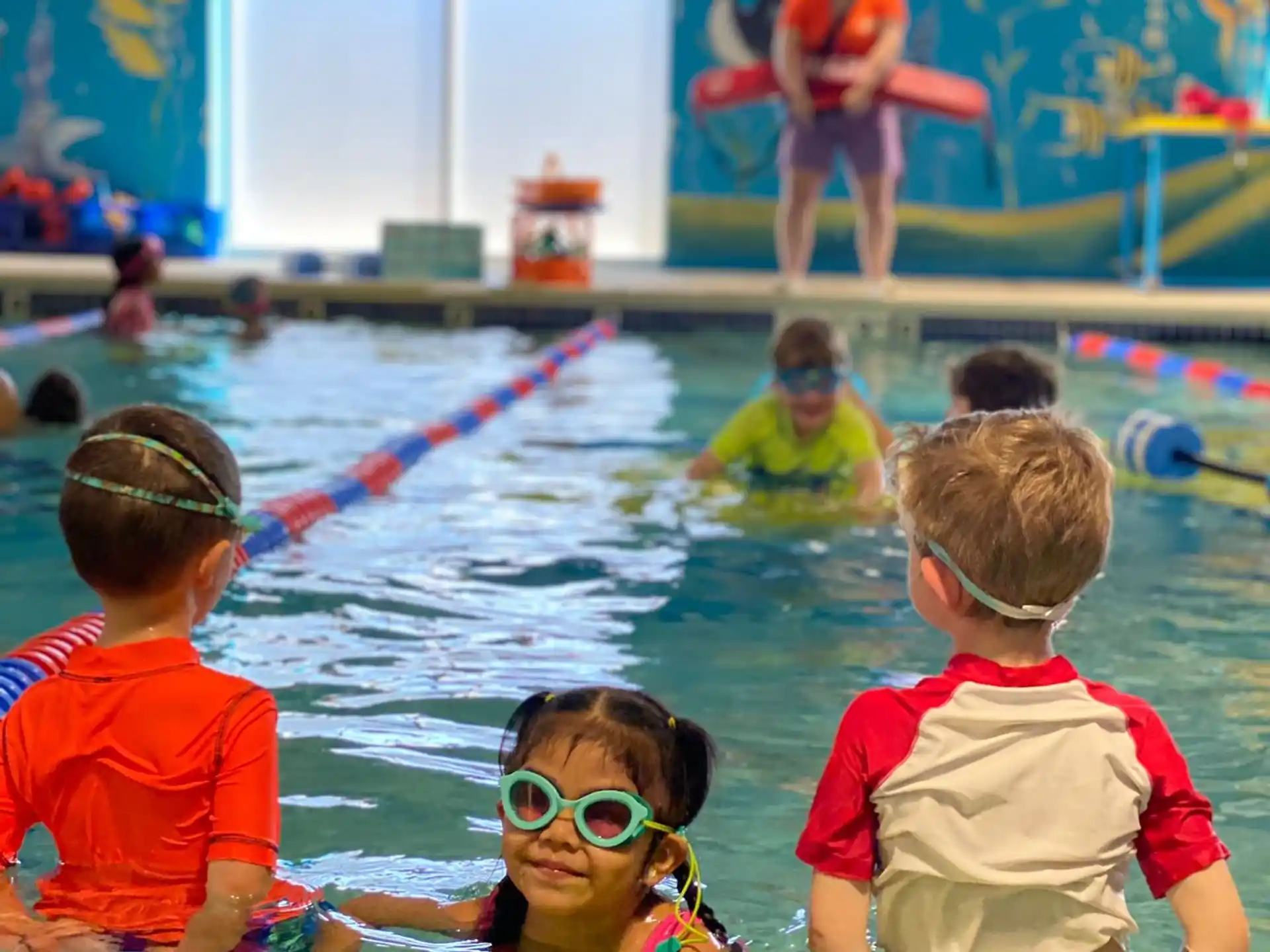 a group of children in a pool