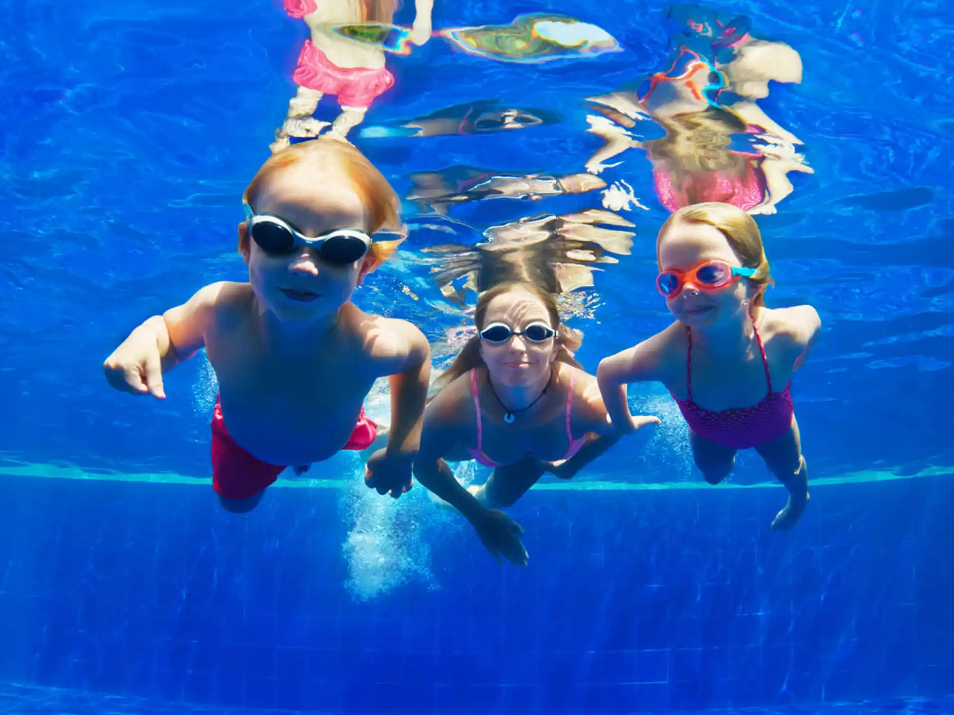 a group of kids in a pool