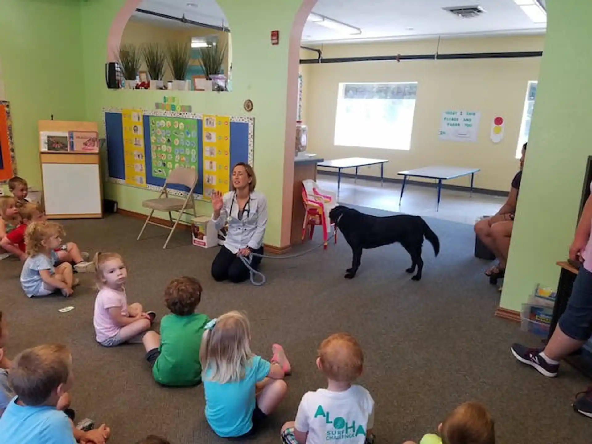a person teaching a group of children