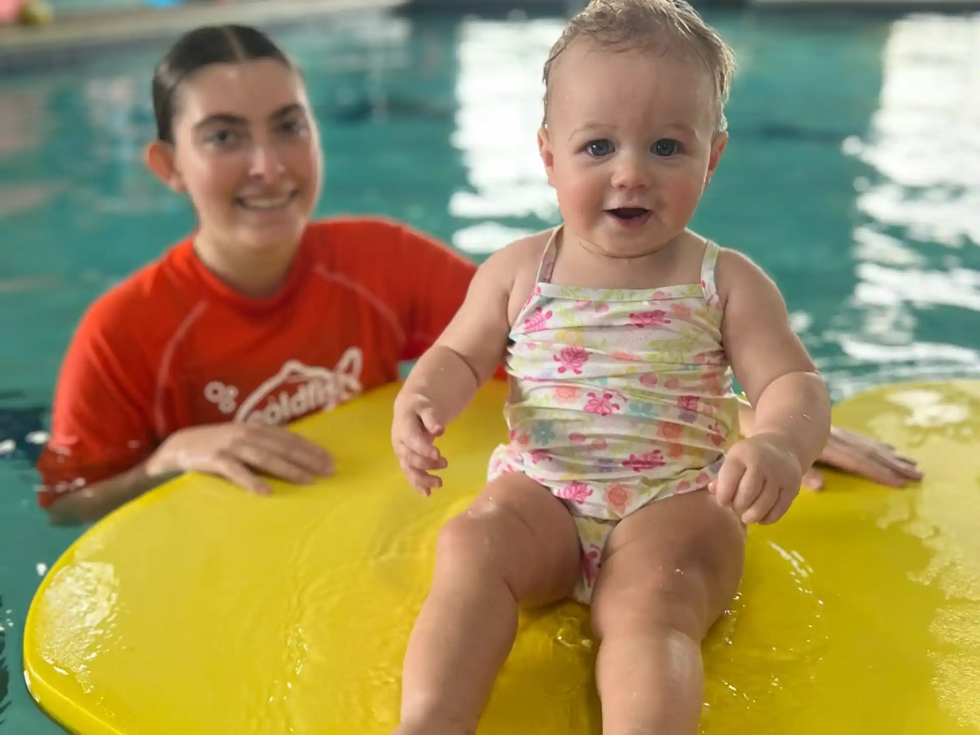 a couple of children in a pool