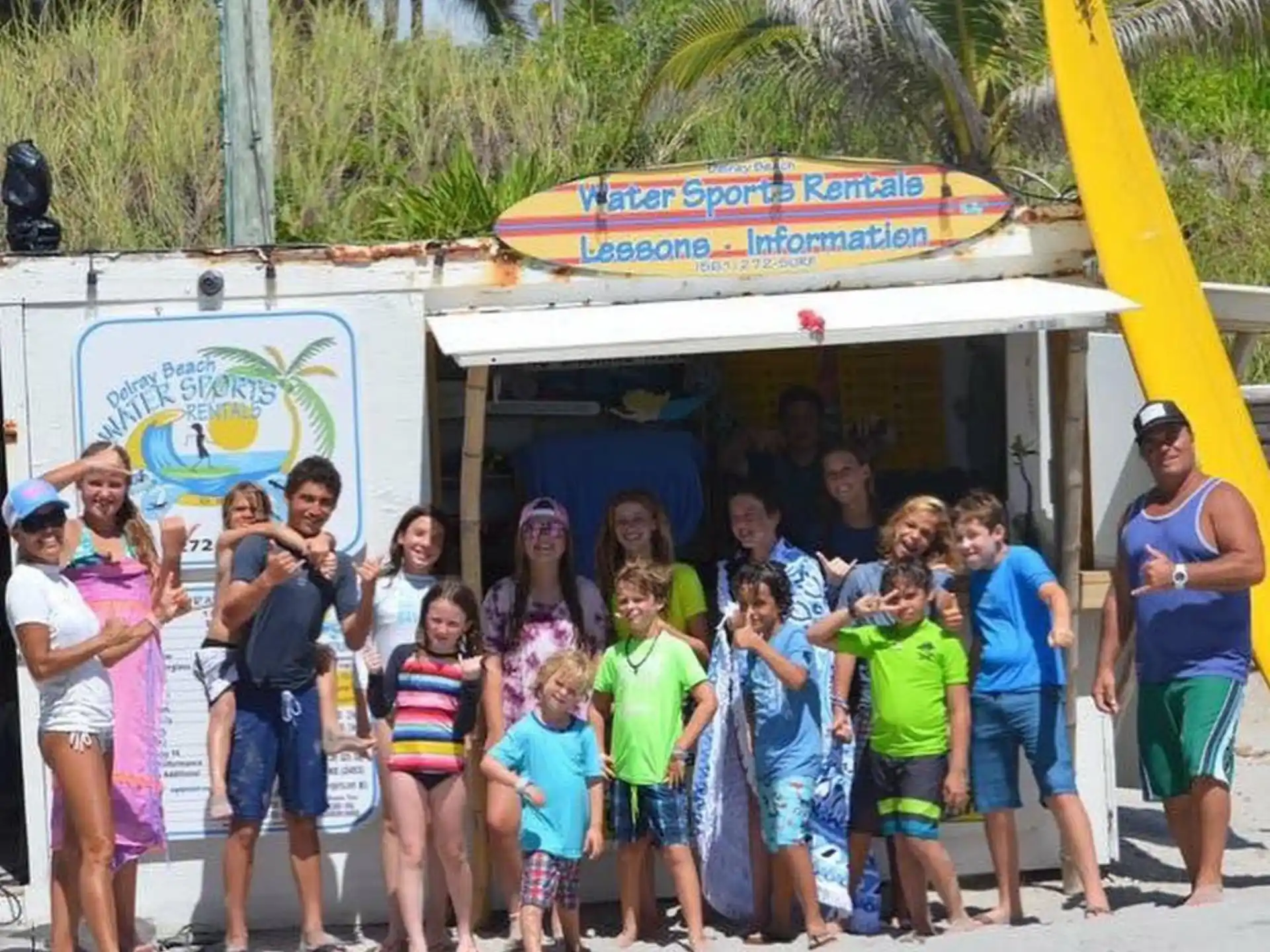 a group of people standing in front of a food truck