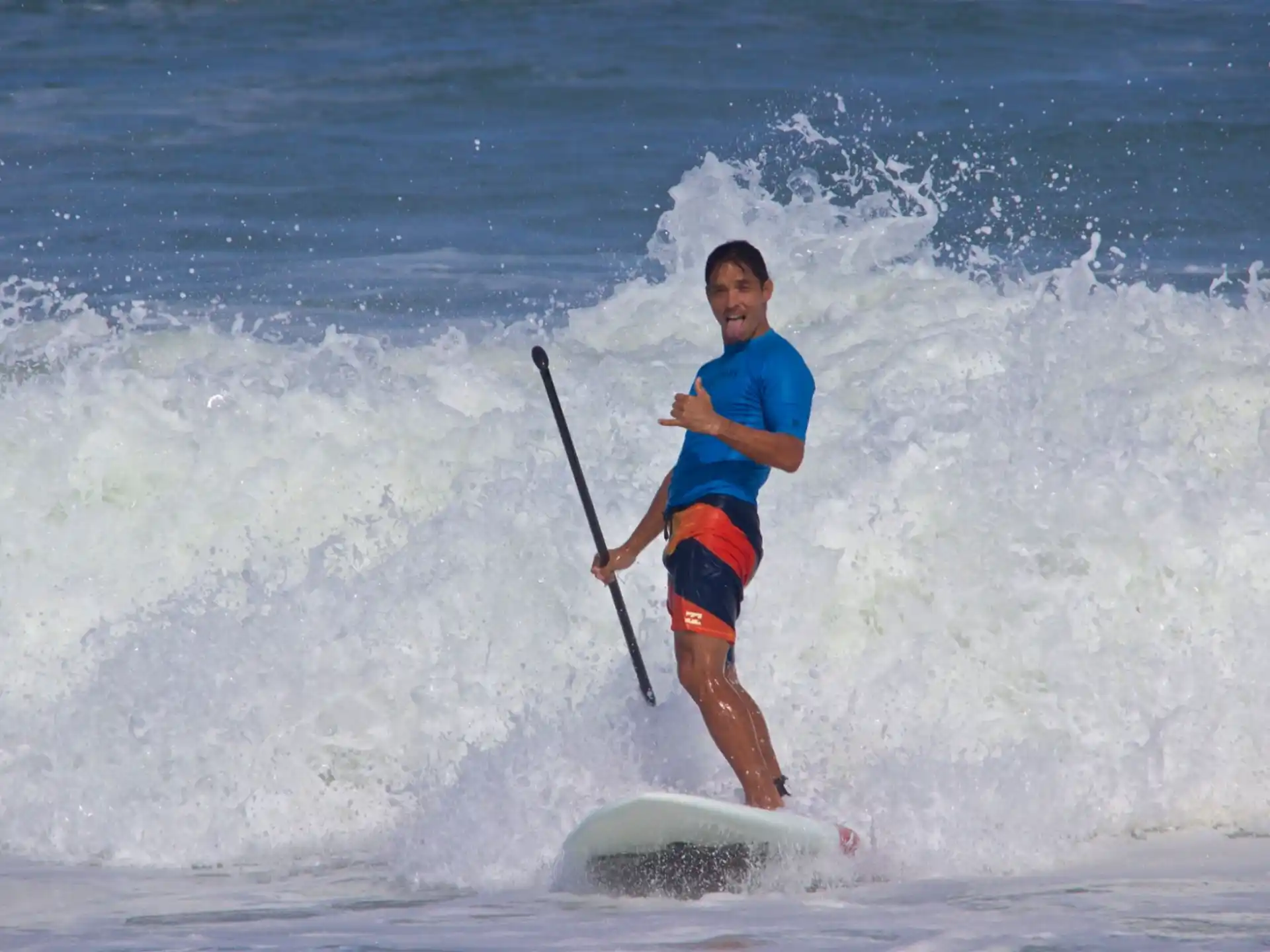 a man surfing on the waves