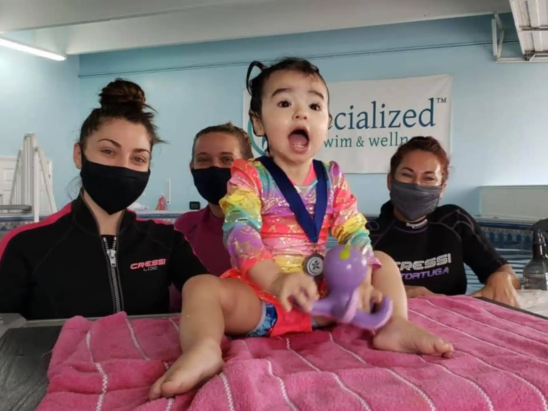 a group of kids wearing masks