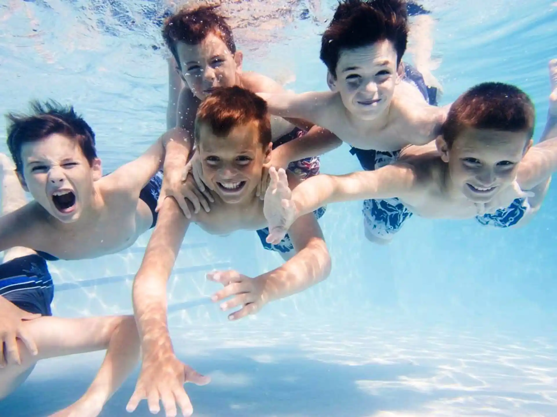 a group of people in a pool