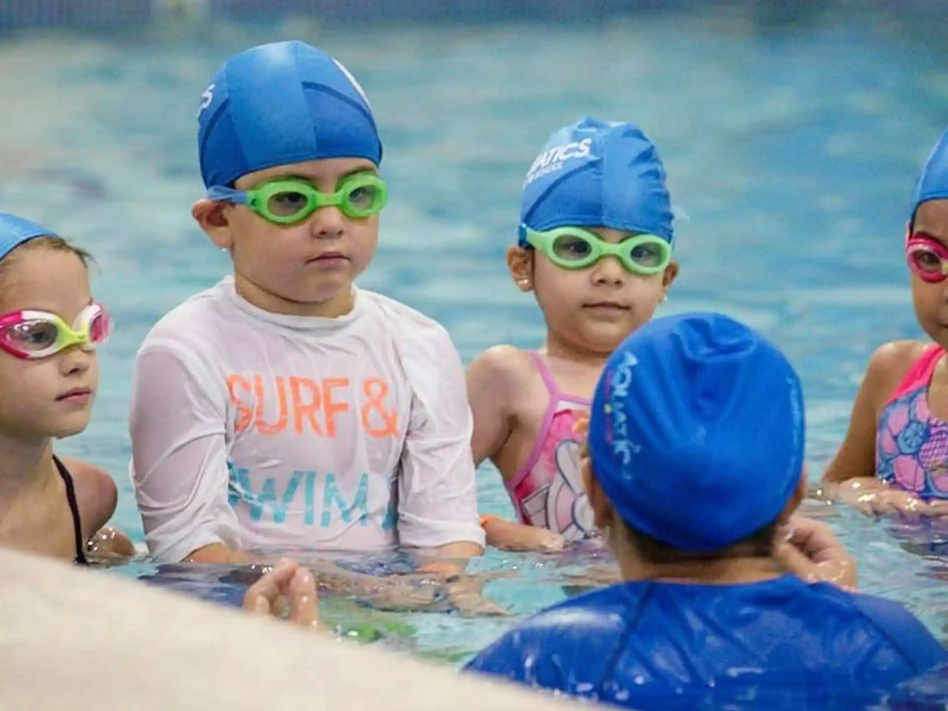 a group of children in a pool