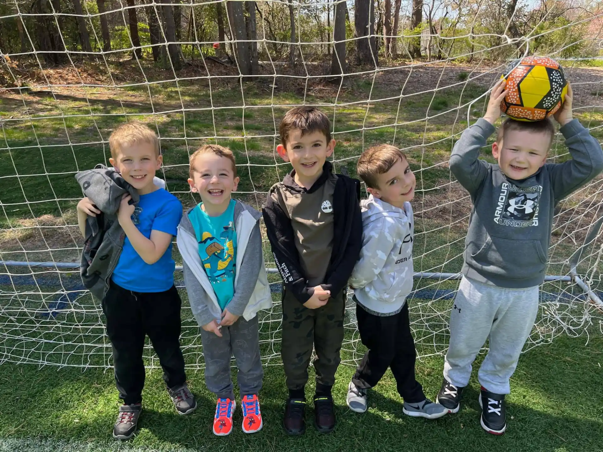 a group of boys posing for a picture
