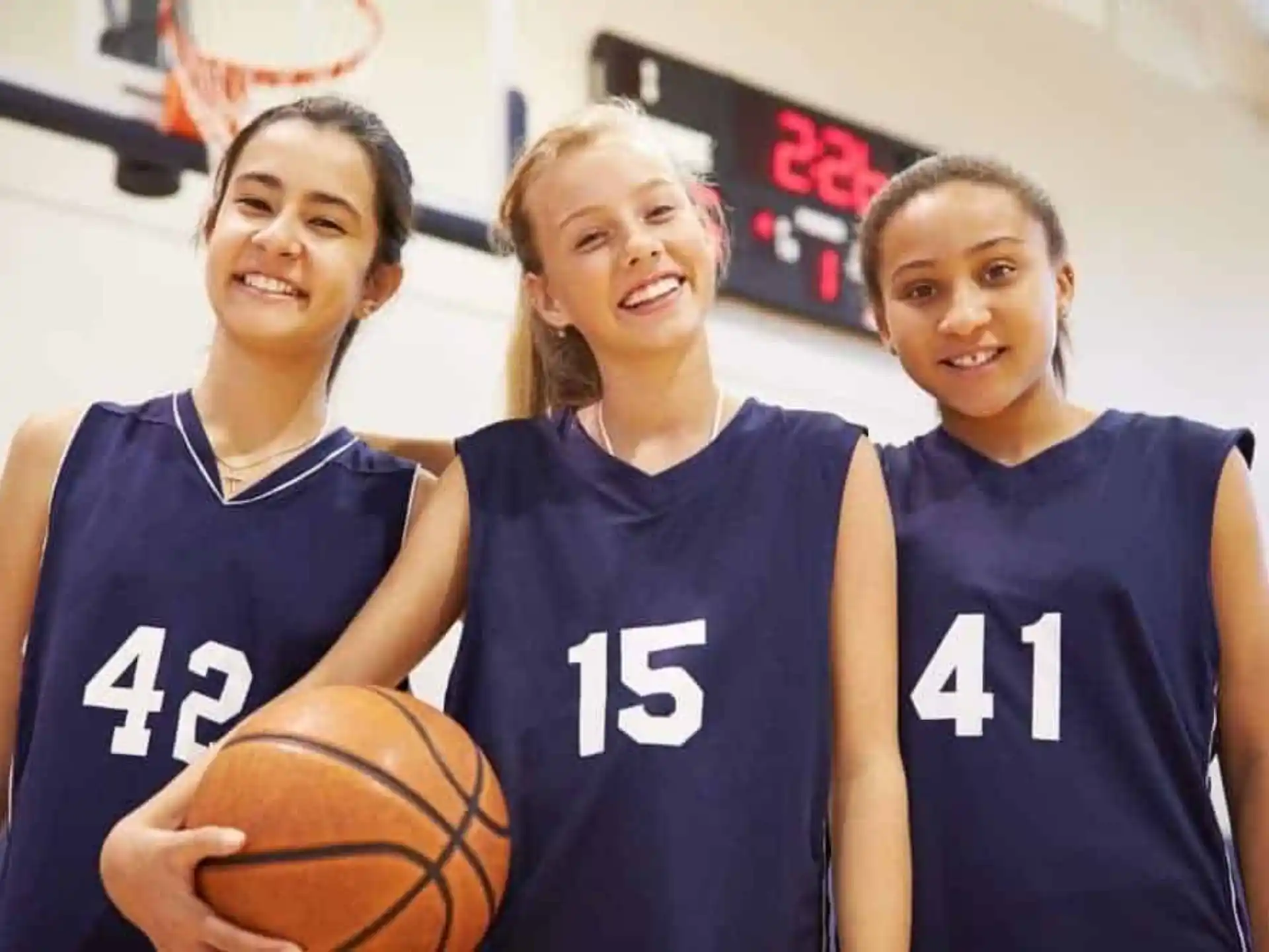 a group of women wearing basketball uniforms