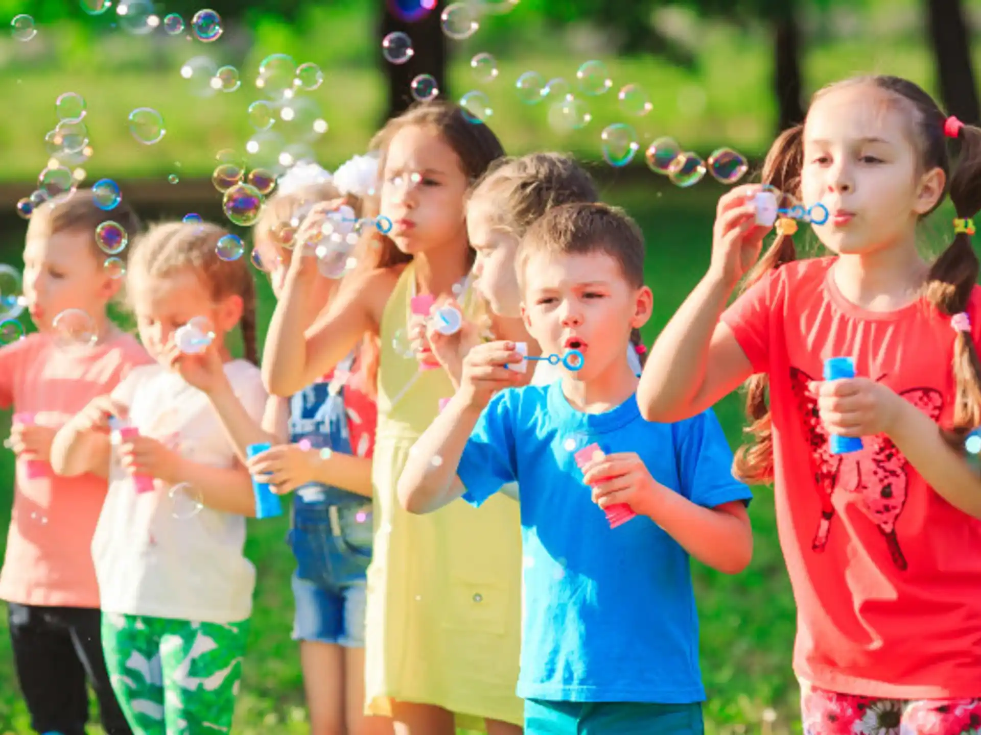 a group of children holding colorful objects