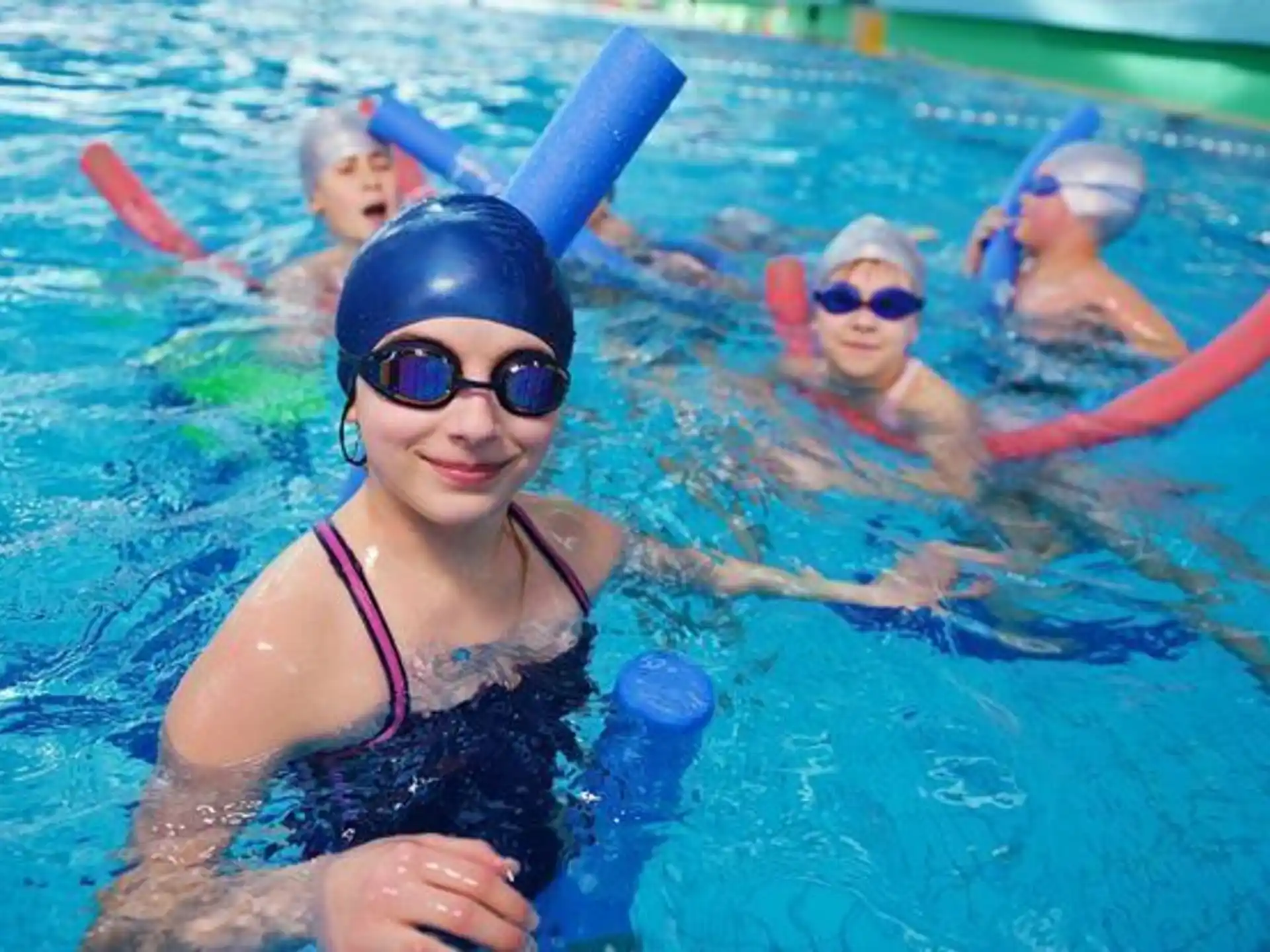a group of people in a pool