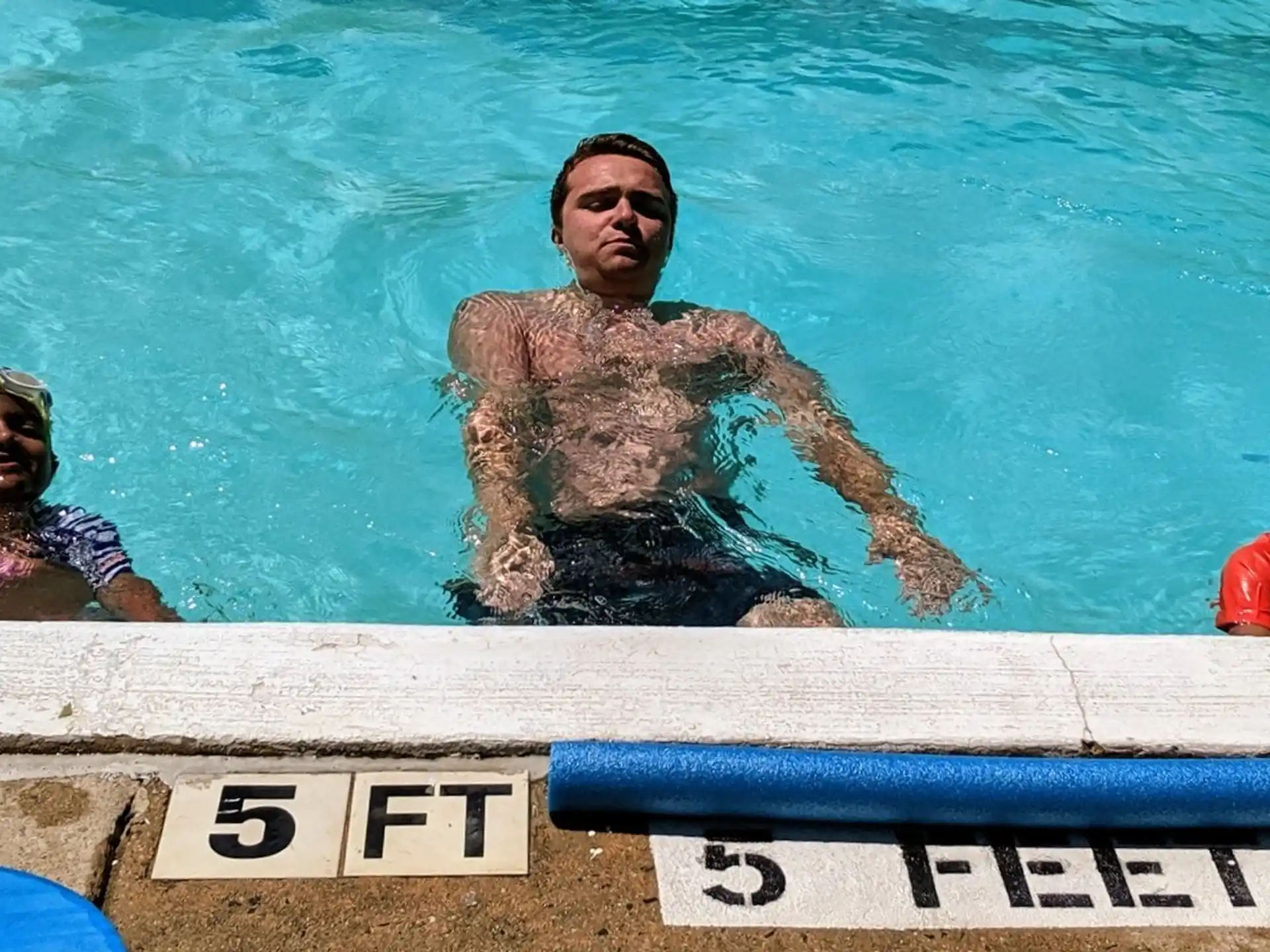 a group of people in a pool