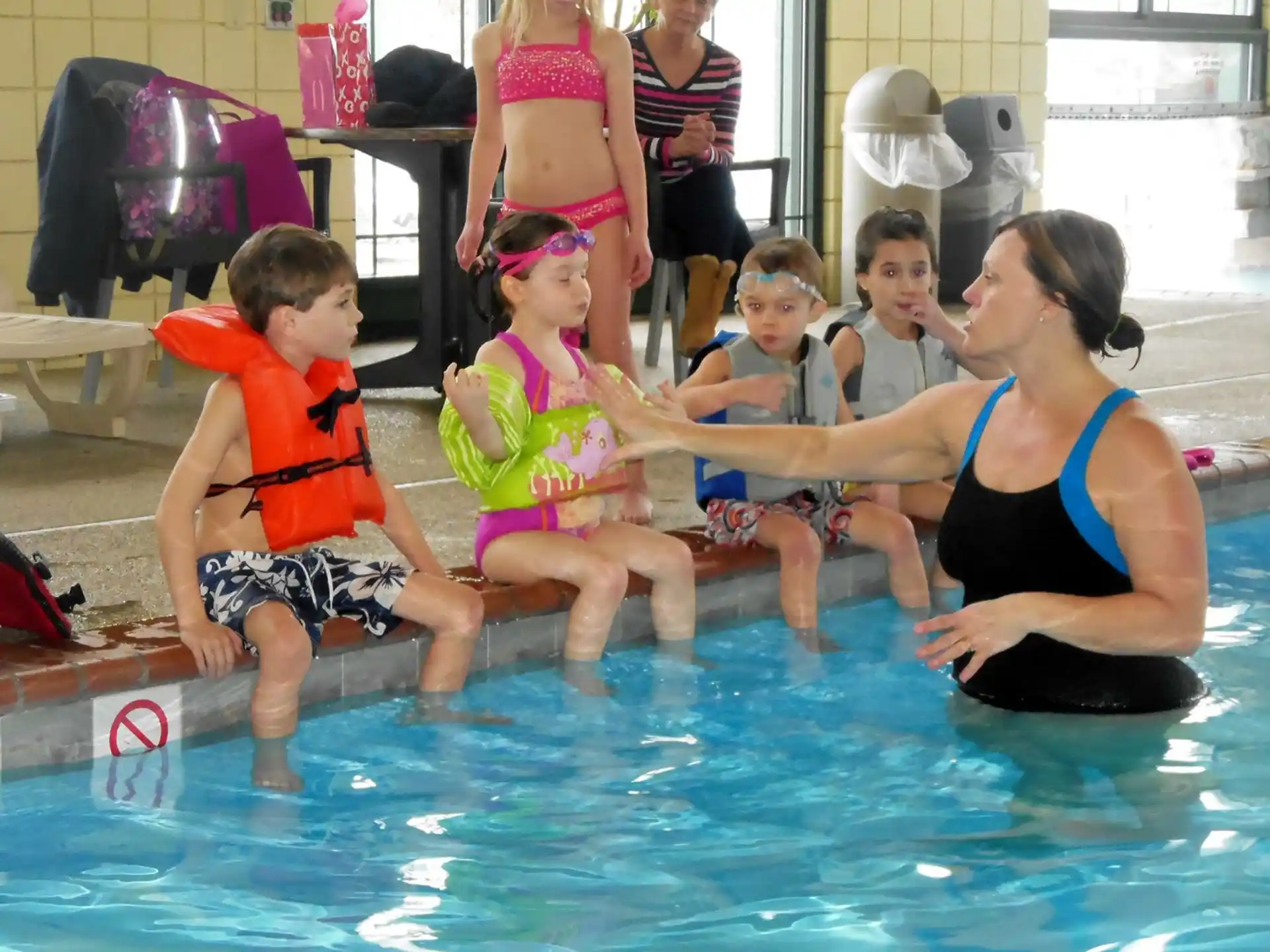 a group of children in a pool