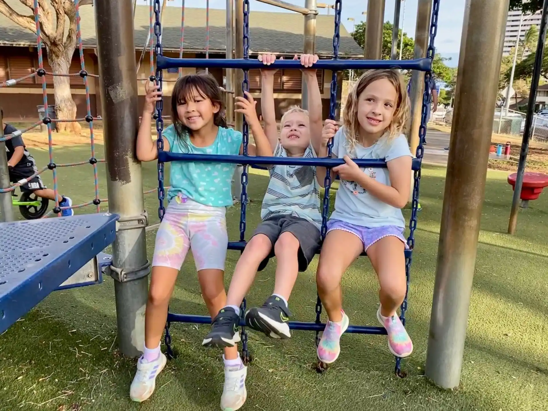 a group of girls on a swing