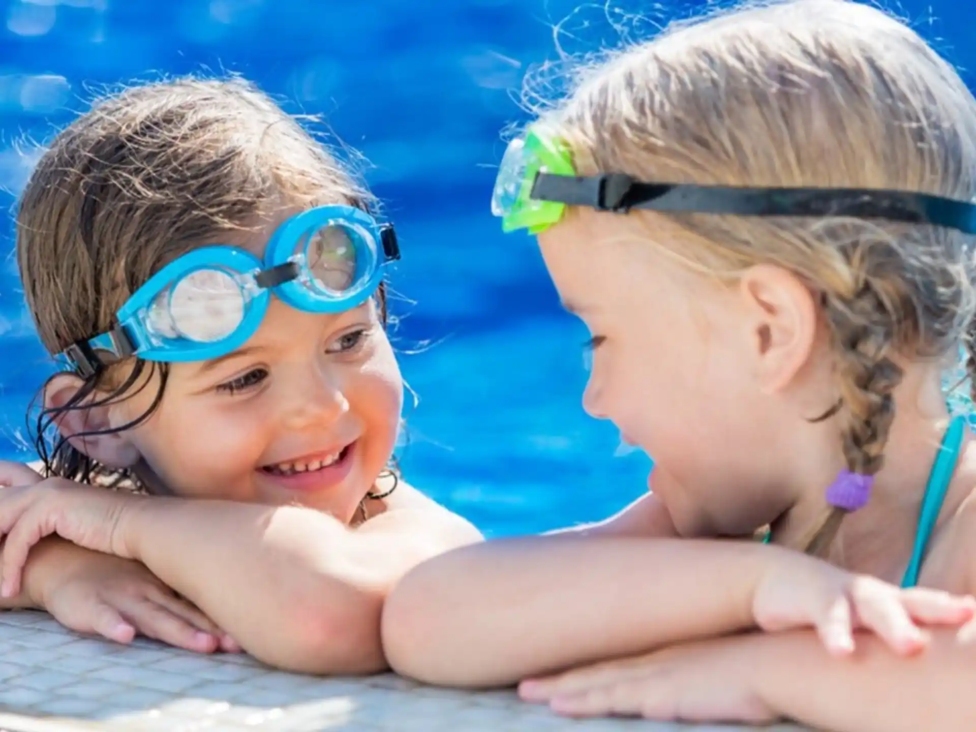 a couple of girls in a pool