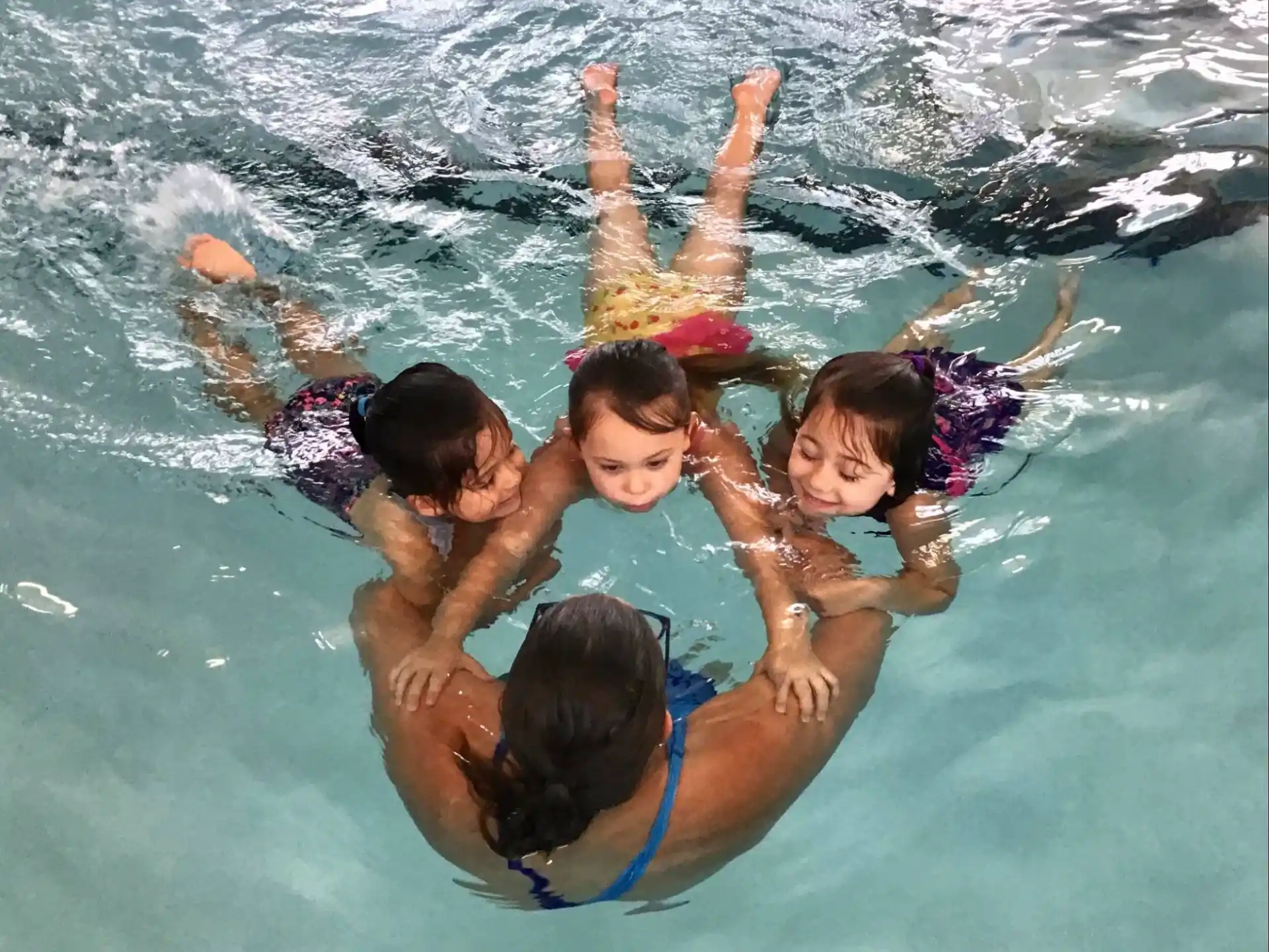 a group of children in a pool
